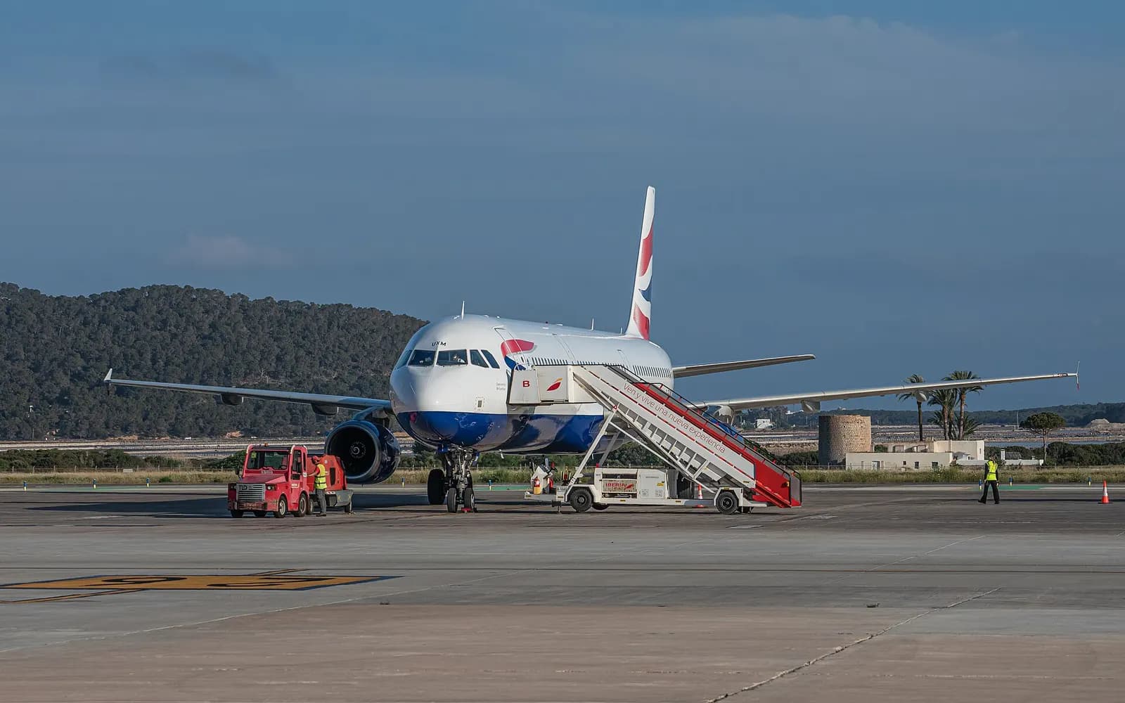 Ibiza Airport terminal façade and curb-side access roads.