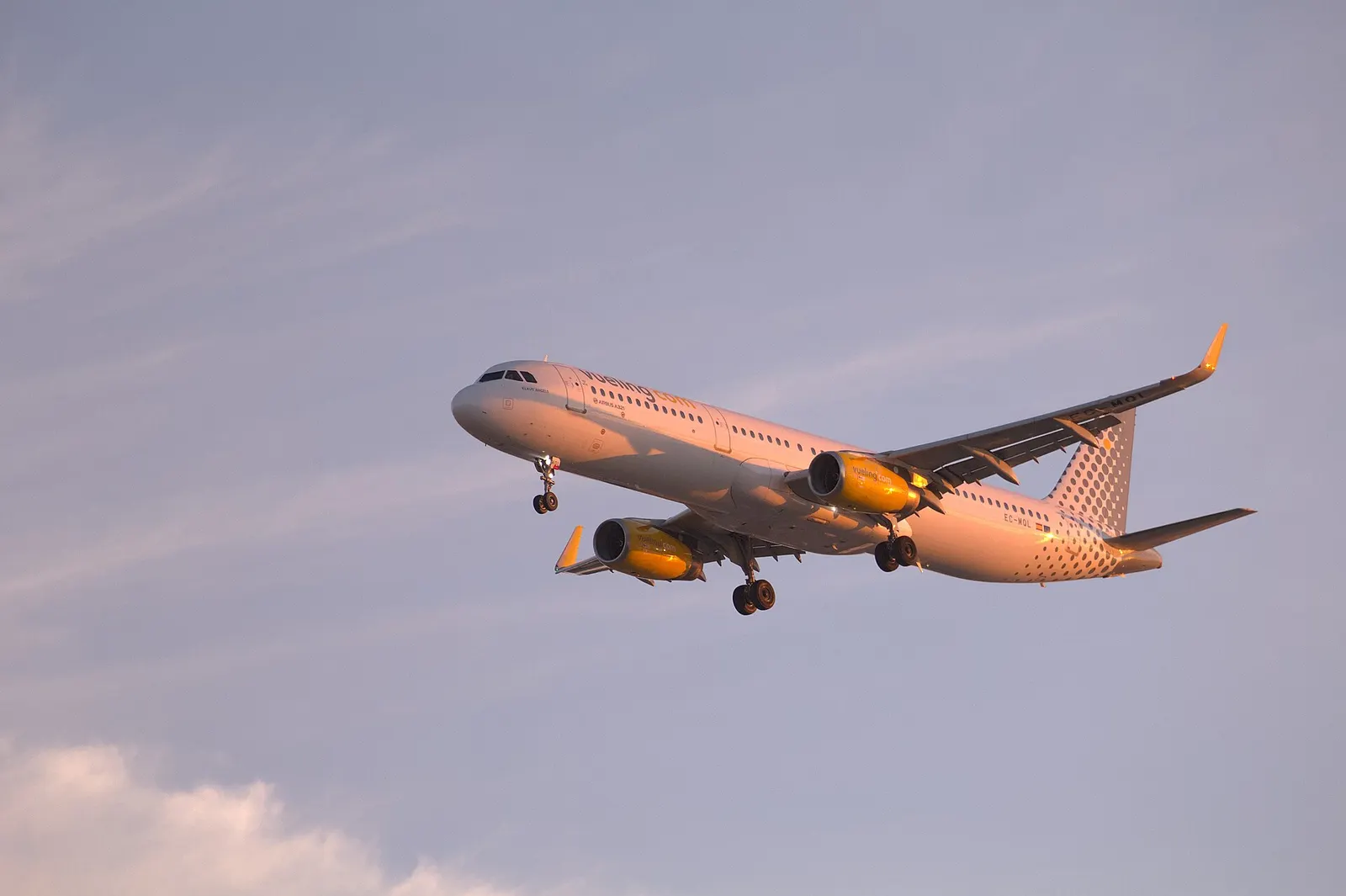 Vueling Airbus A321 on final approach to Ibiza Airport at sunrise.