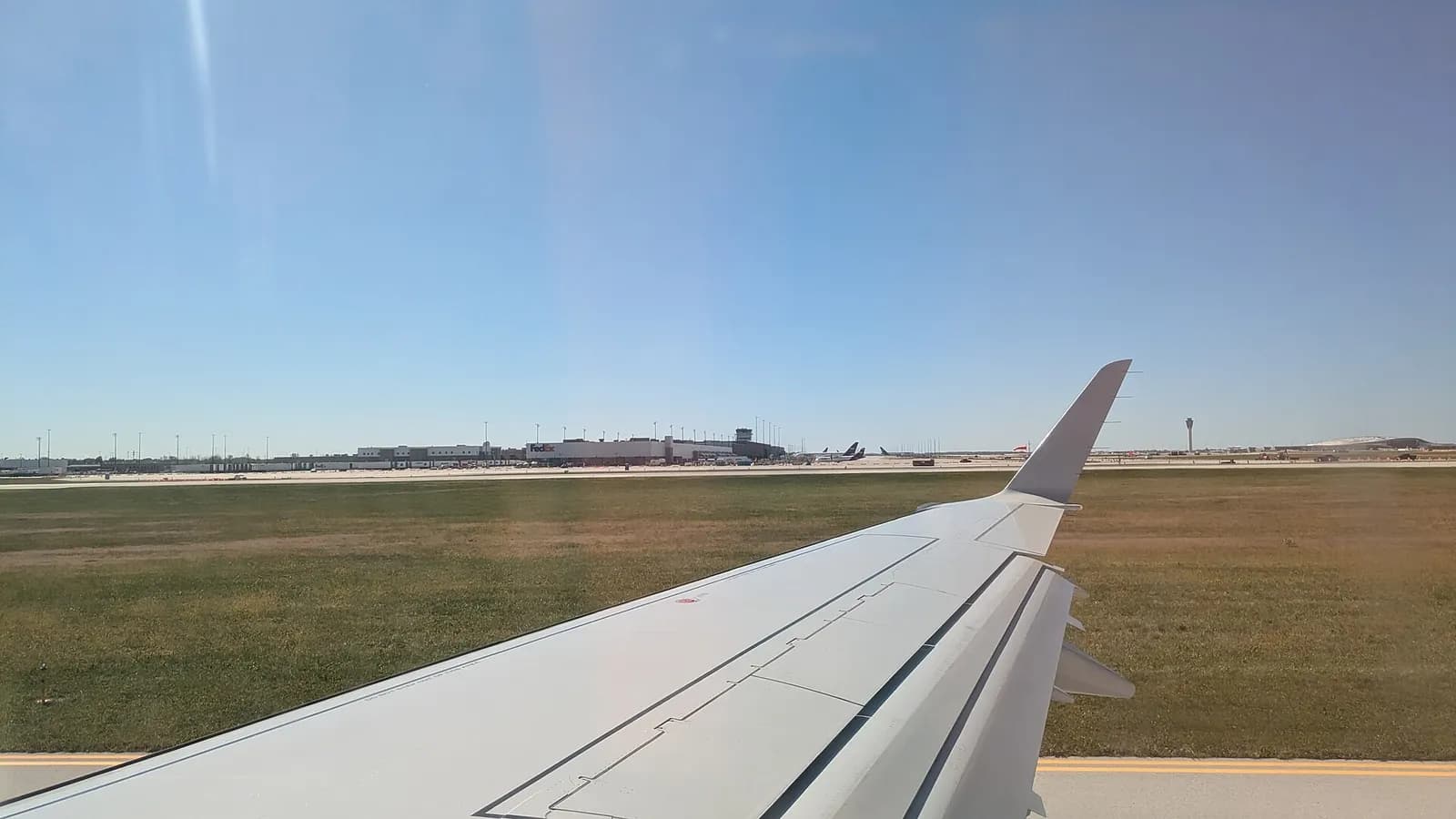 View of the FedEx cargo terminal at Indianapolis International Airport, from an aircraft taxiing for takeoff on a Monday afternoon.
