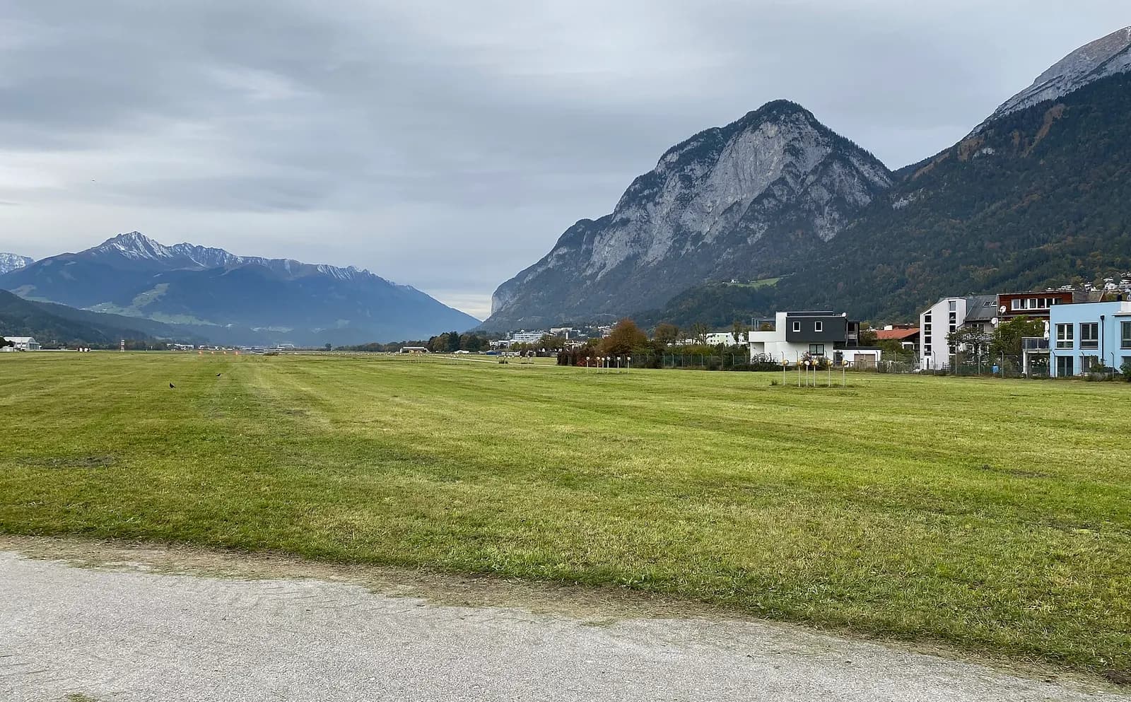 Innsbruck Airport terminal east façade with mountains behind