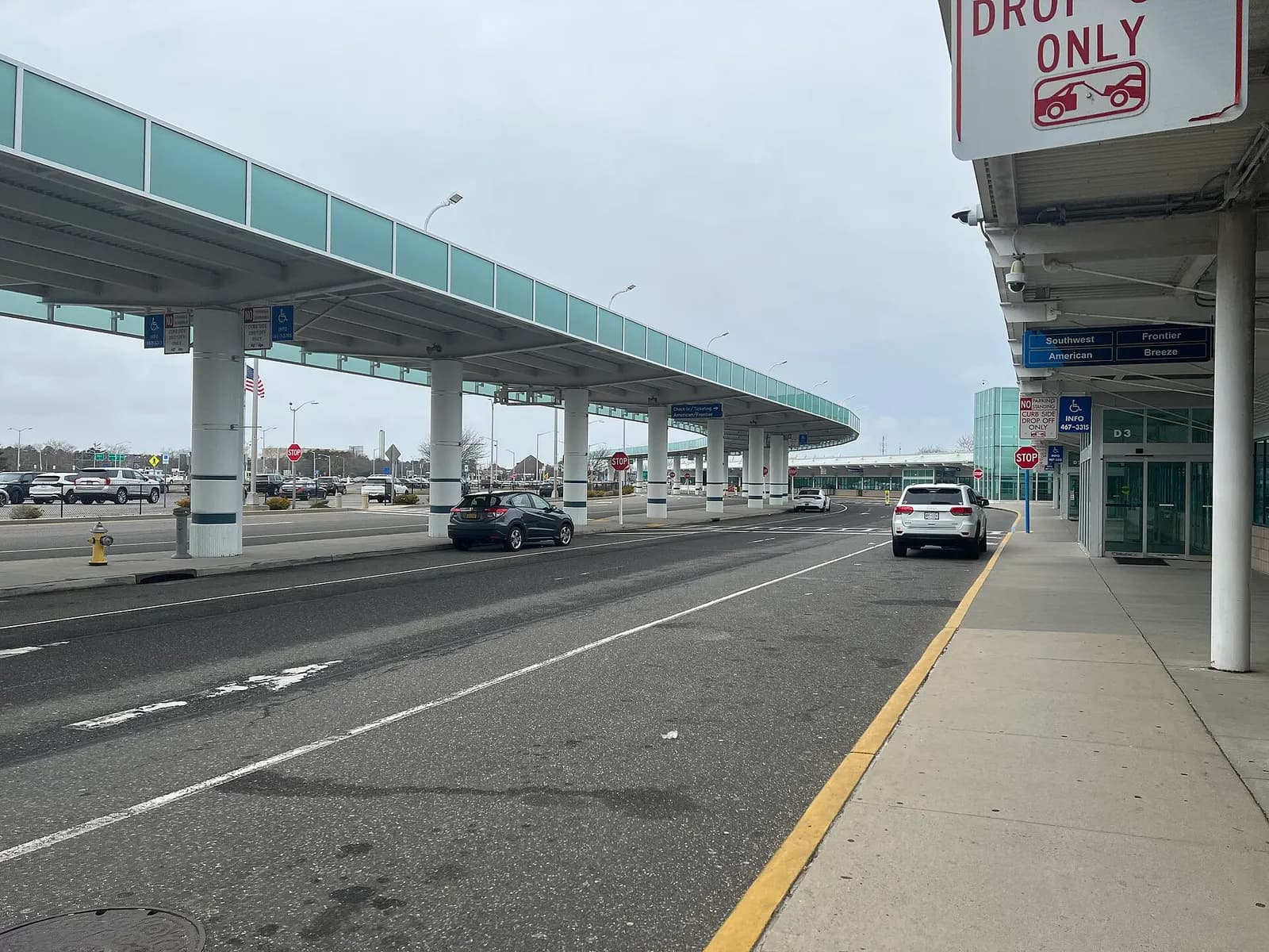 Landside hall of Long Island MacArthur Airport’s passenger terminal on 20 February 2023, looking toward ticketing and the screening story.