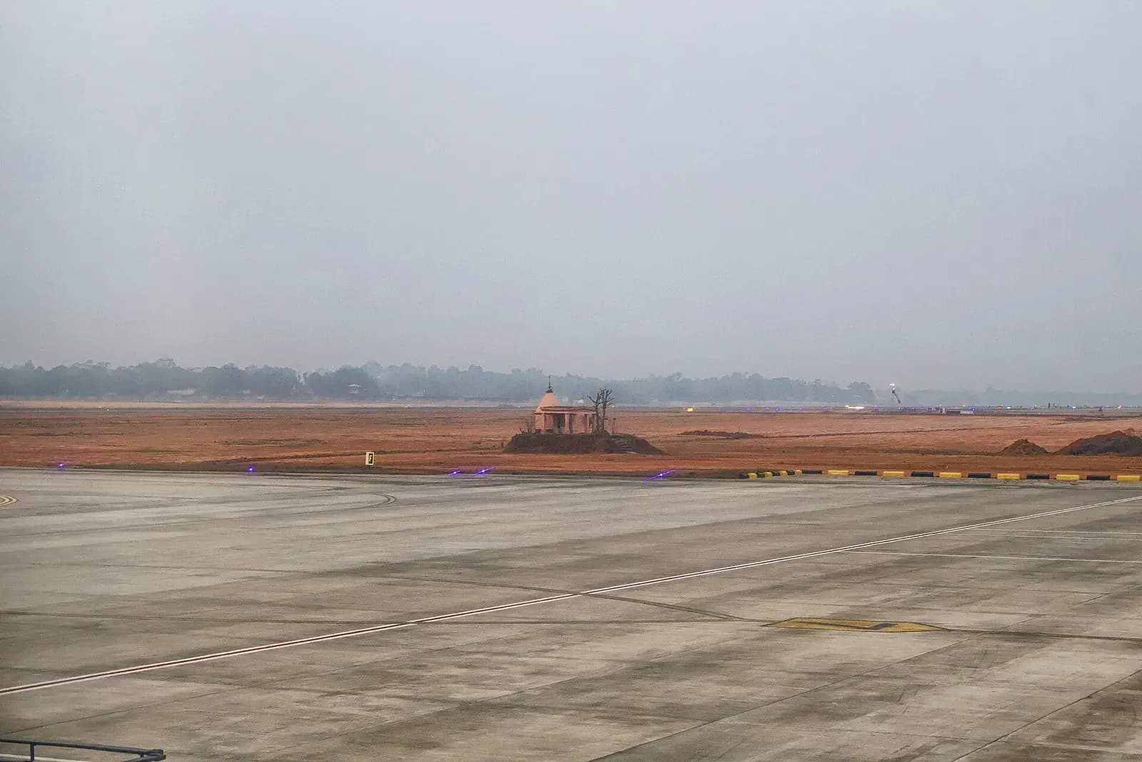 Small temple structure on the airfield grounds at Maharaja Bir Bikram Airport, Agartala.