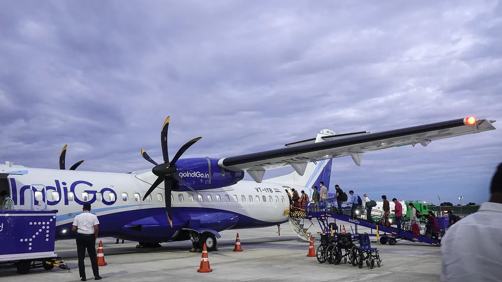 Indigo ATR72-600 VT-IYB. Flight 6E7593 Madurai - Chennai. Passengers boarding from rear. Madurai Airport, Tamil Nadu, India