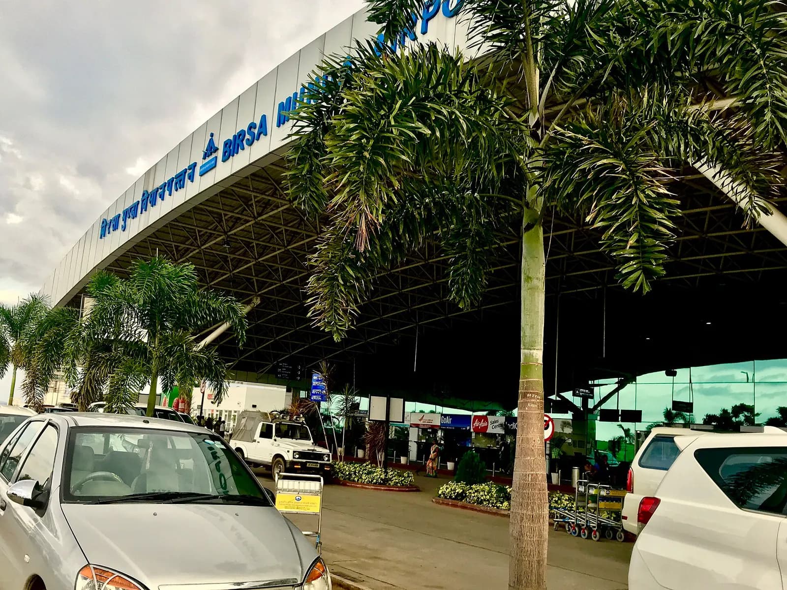 Birsa Munda Airport terminal entrance with airline counters visible, Ranchi
