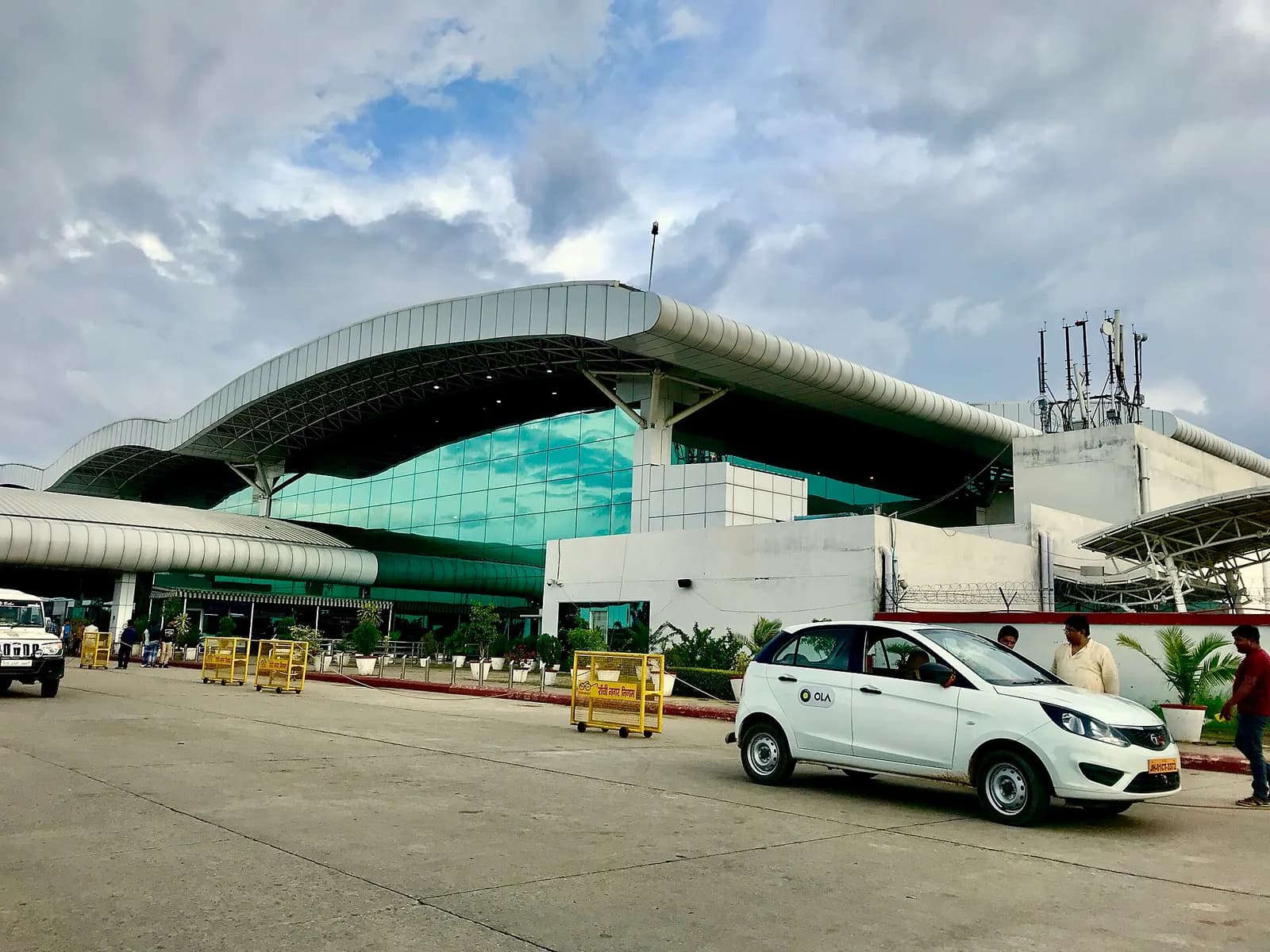 Birsa Munda Airport terminal exterior with green glass facade, Ranchi