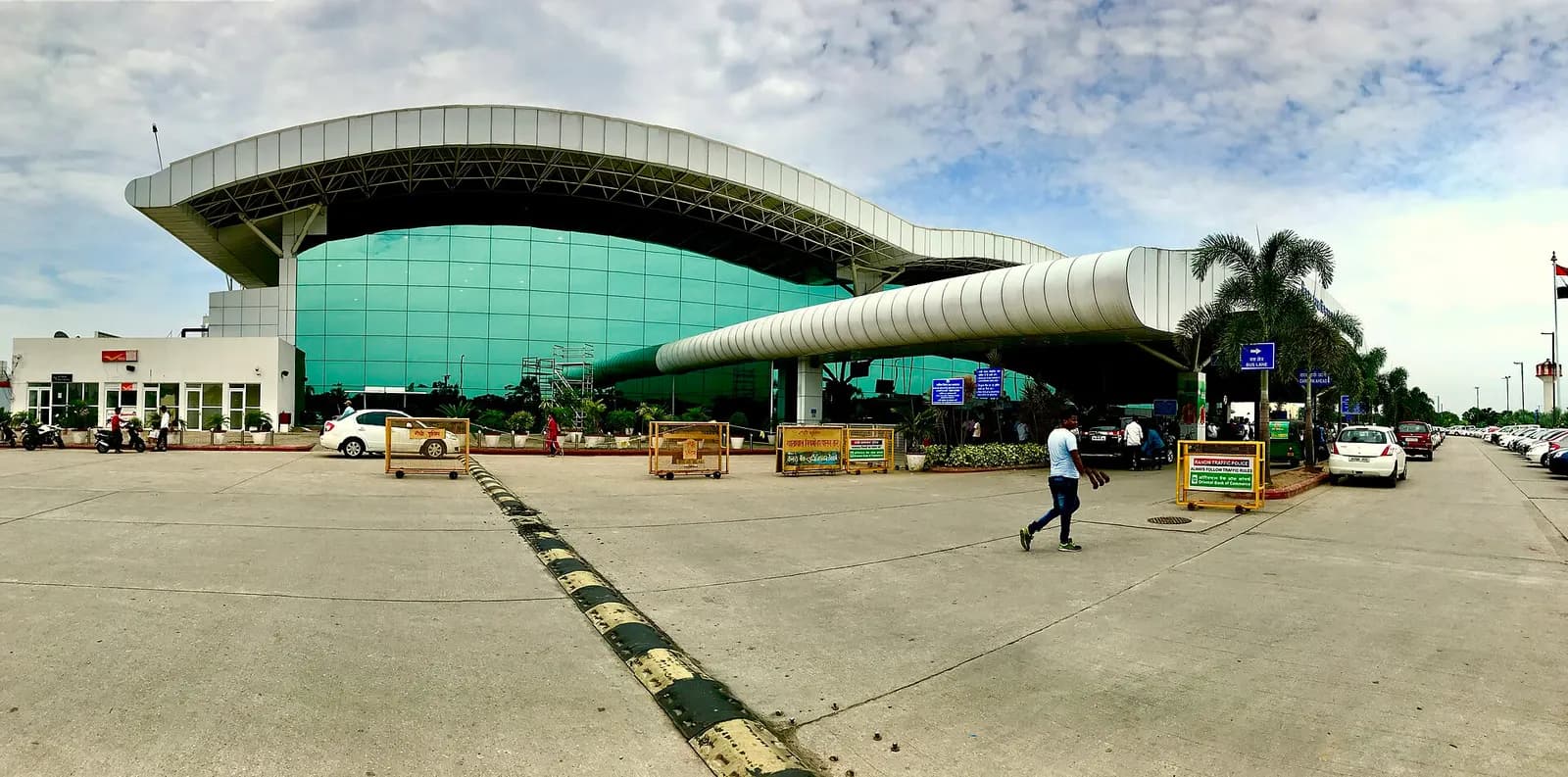 Panorama of Birsa Munda Airport terminal kerb and curved canopy, Ranchi