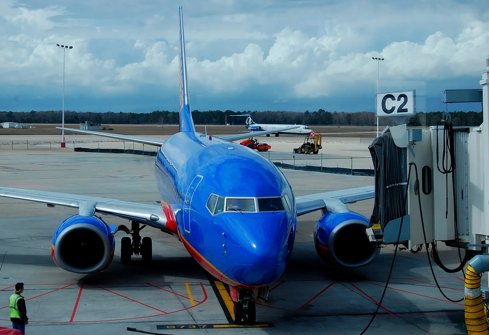 Southwest 737 on stand at Jacksonville International Airport Gate C2 with Allegiant behind