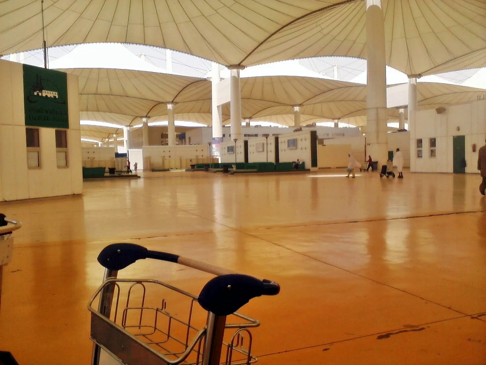 The iconic Hajj Terminal at Jeddah features a vast white tensile fabric roof supported by pointed mast structures.