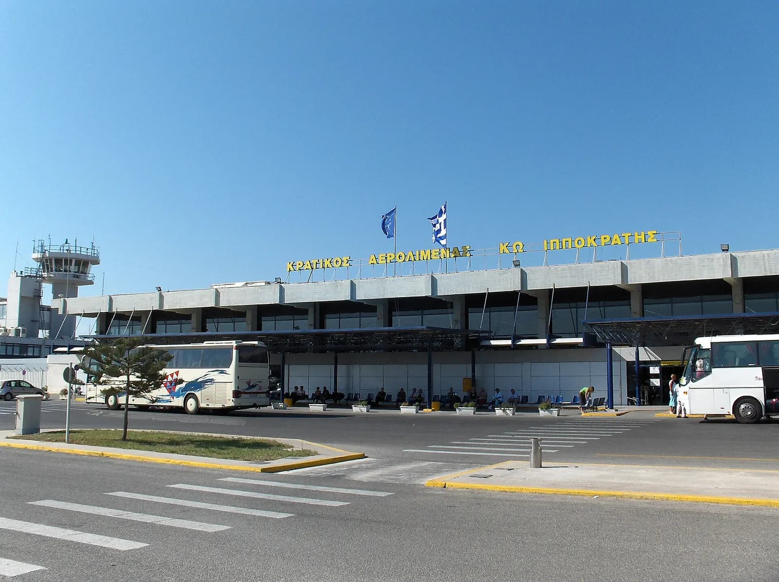 Kos Airport terminal building and parking/forecourt area.