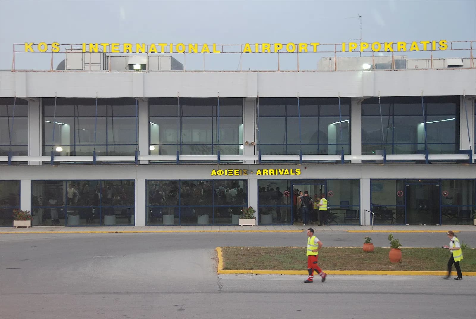 Kos International Airport Ippokratis terminal exterior with parked aircraft.