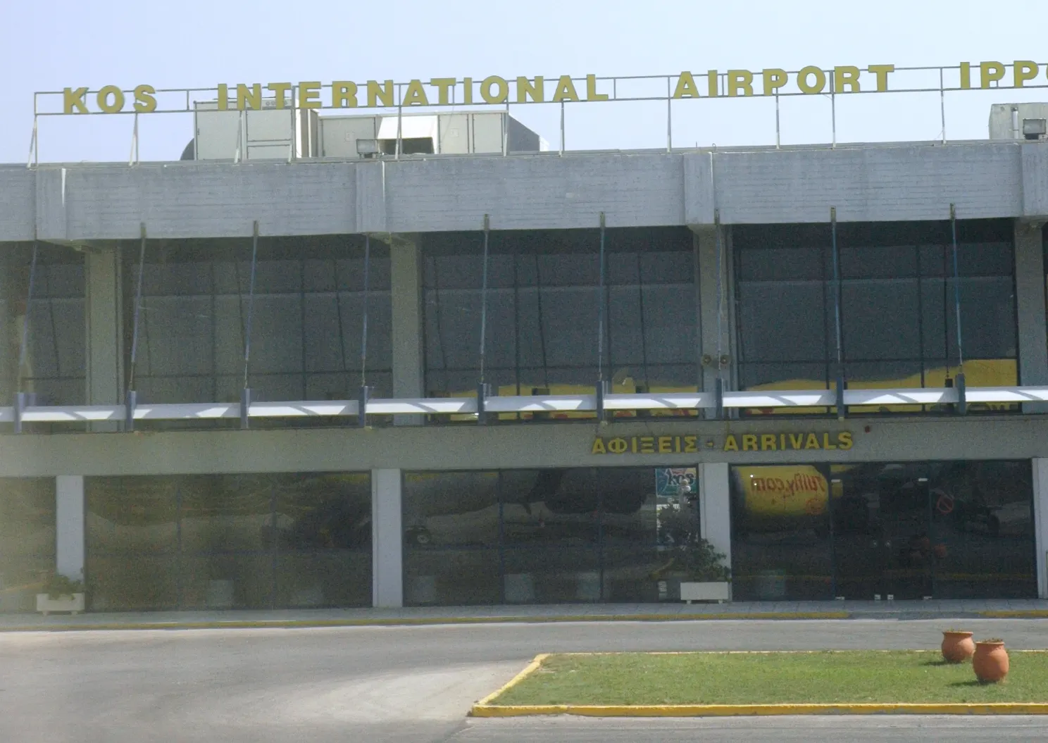 Earlier view of Kos Airport terminal and apron area.