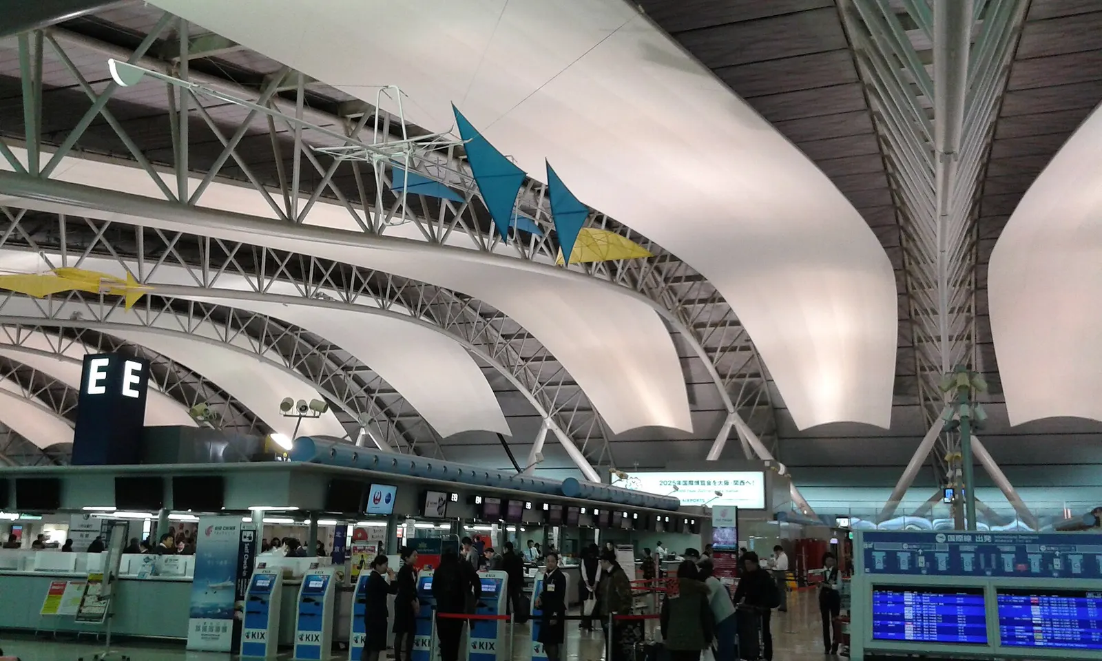 Panoramic view showing both Terminal 1 and Terminal 2 at Kansai International Airport alongside the airfield.