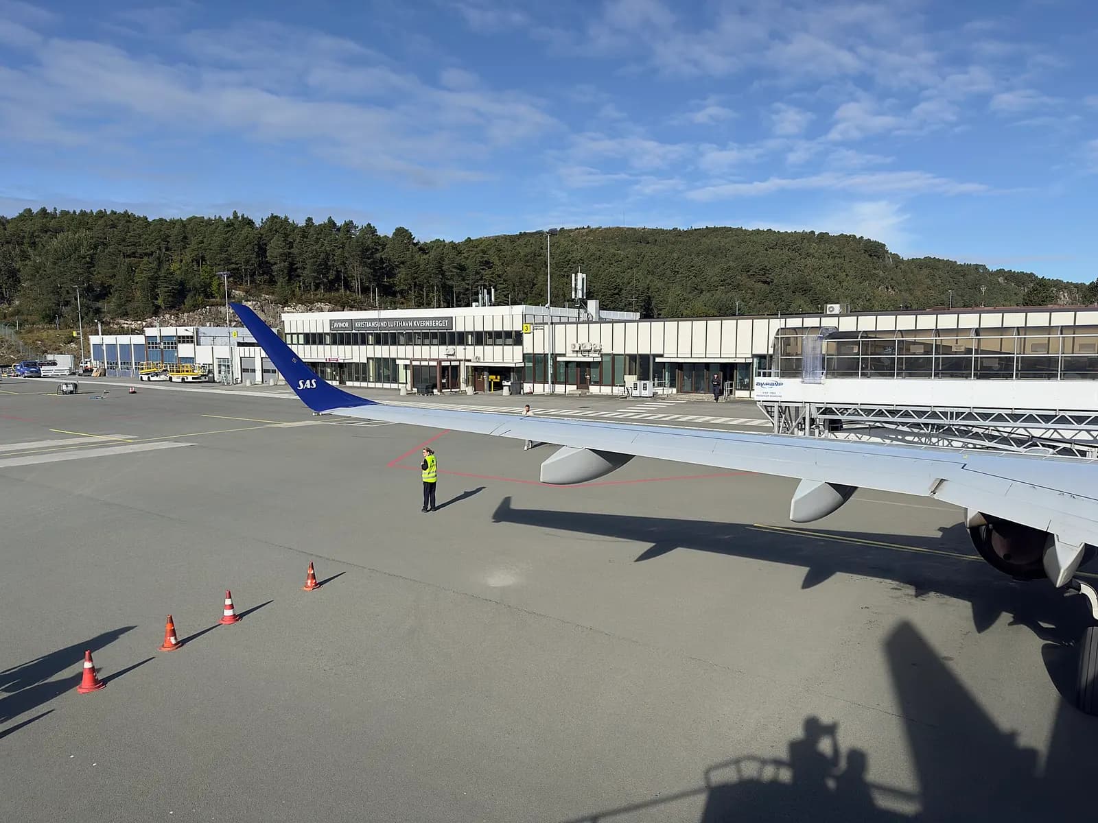 Airside view from Kristiansund Airport with aircraft wing and surroundings