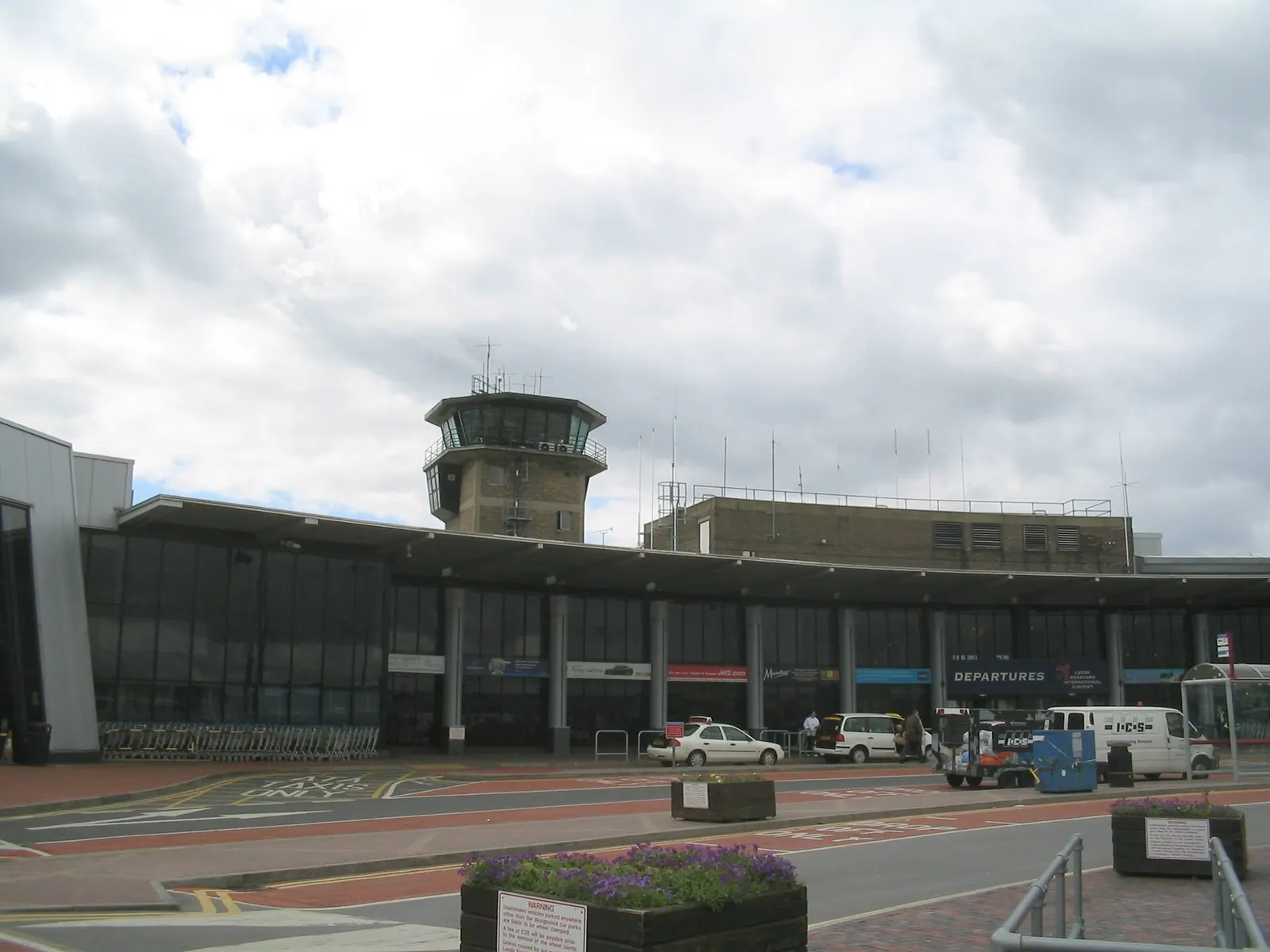 The terminal and control tower at Leeds Bradford International Airport .