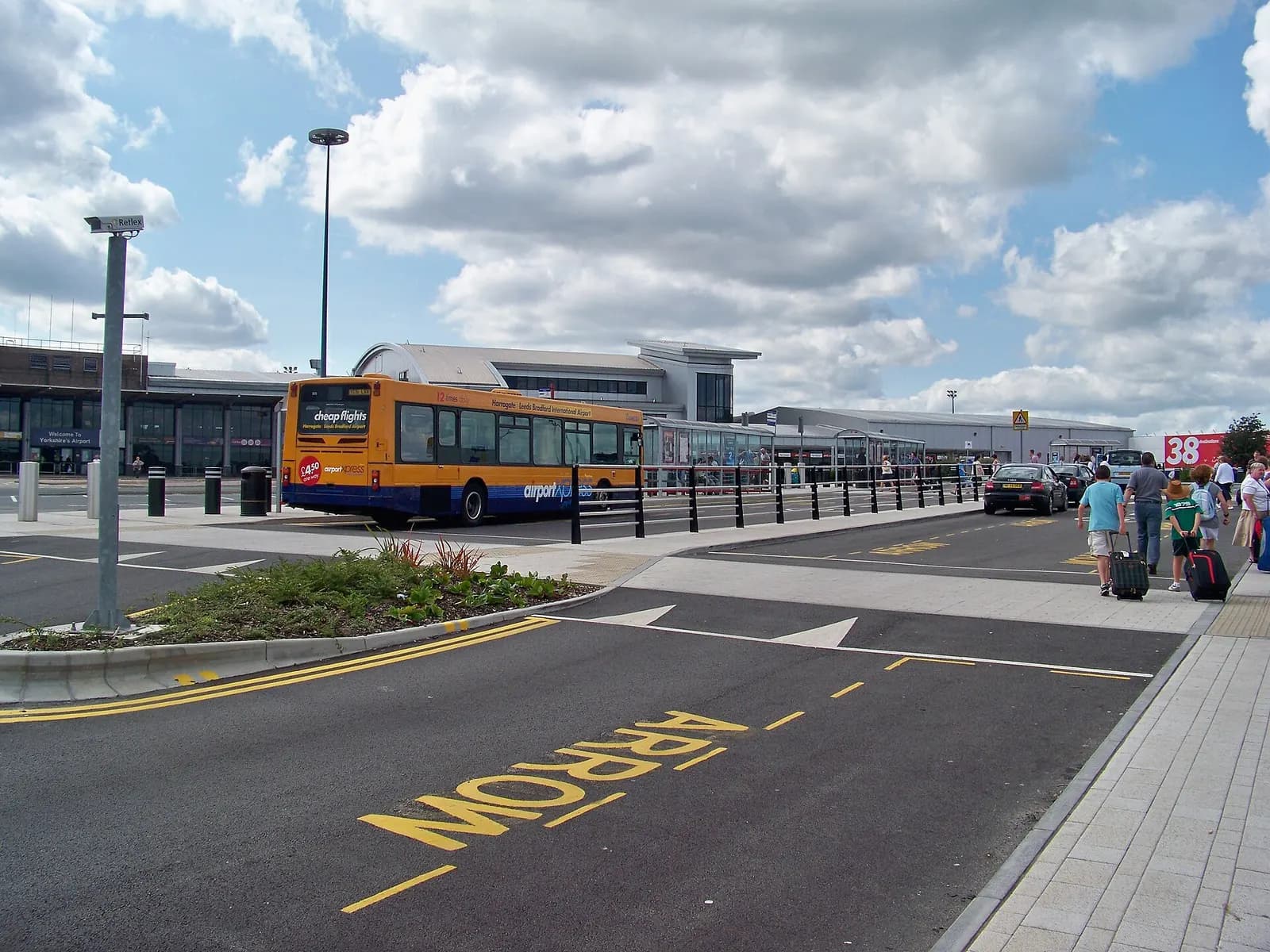 The bus interchange at Leeds Bradford International Airport. Taken on the afternoon of Saturday 22nd August 2009. The bus in view is Trandev Harrogate & District 305 (YC51 LXX), a 