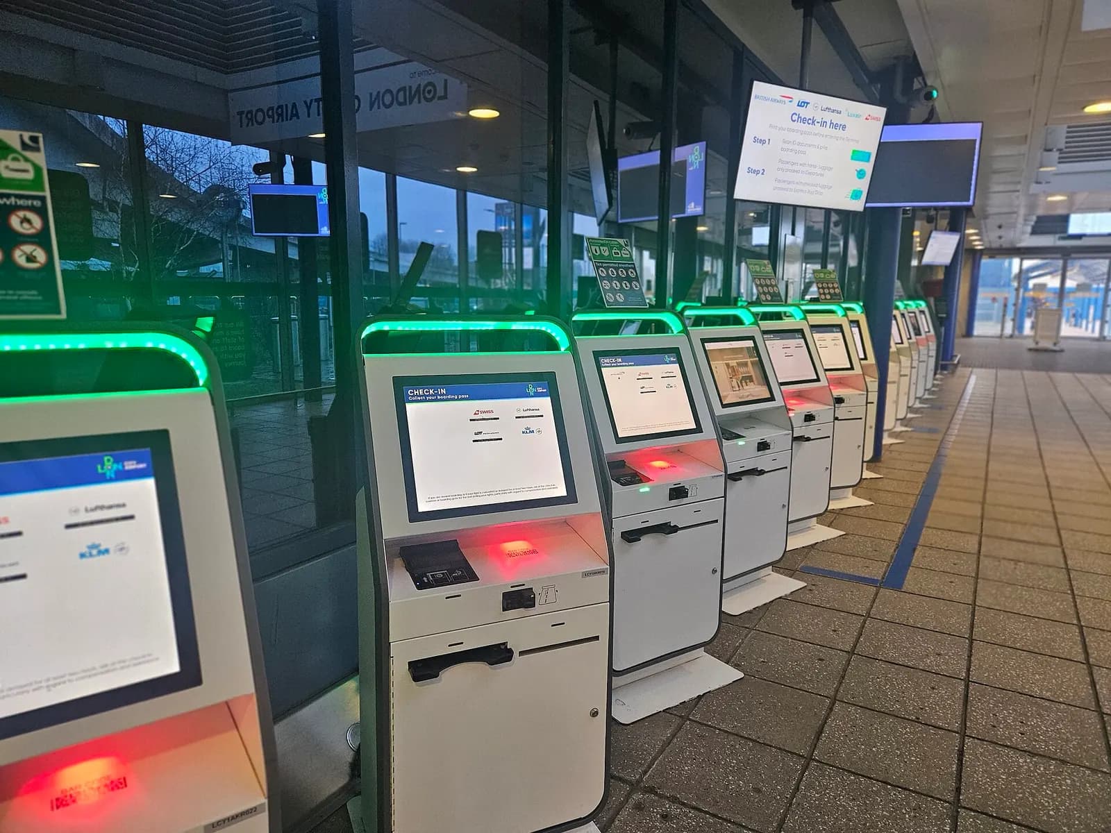 Self-service check-in kiosks inside London City Airport, January 2025