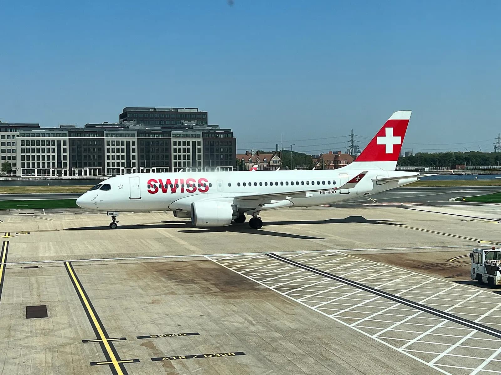Swiss Airbus A220-100 on stand at London City Airport