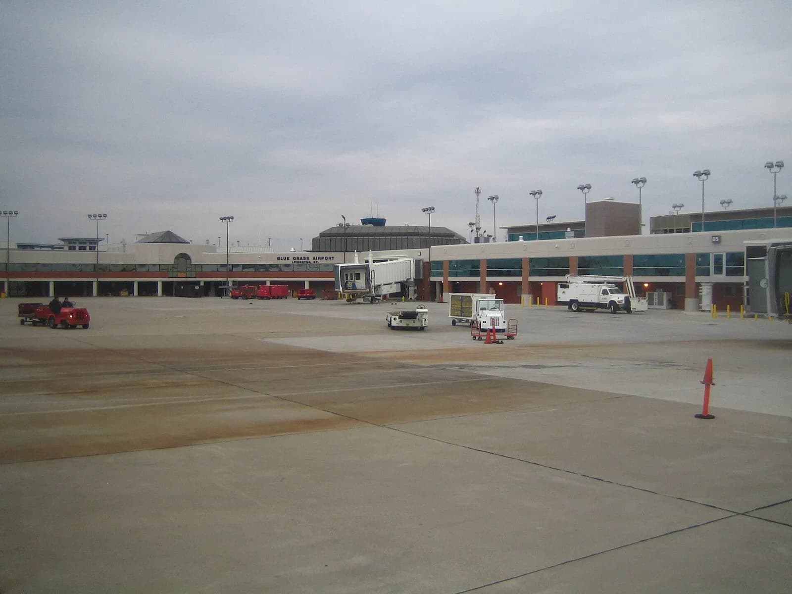 Overcast apron view of the Blue Grass Airport passenger building and jet bridges, photographed in 2007.