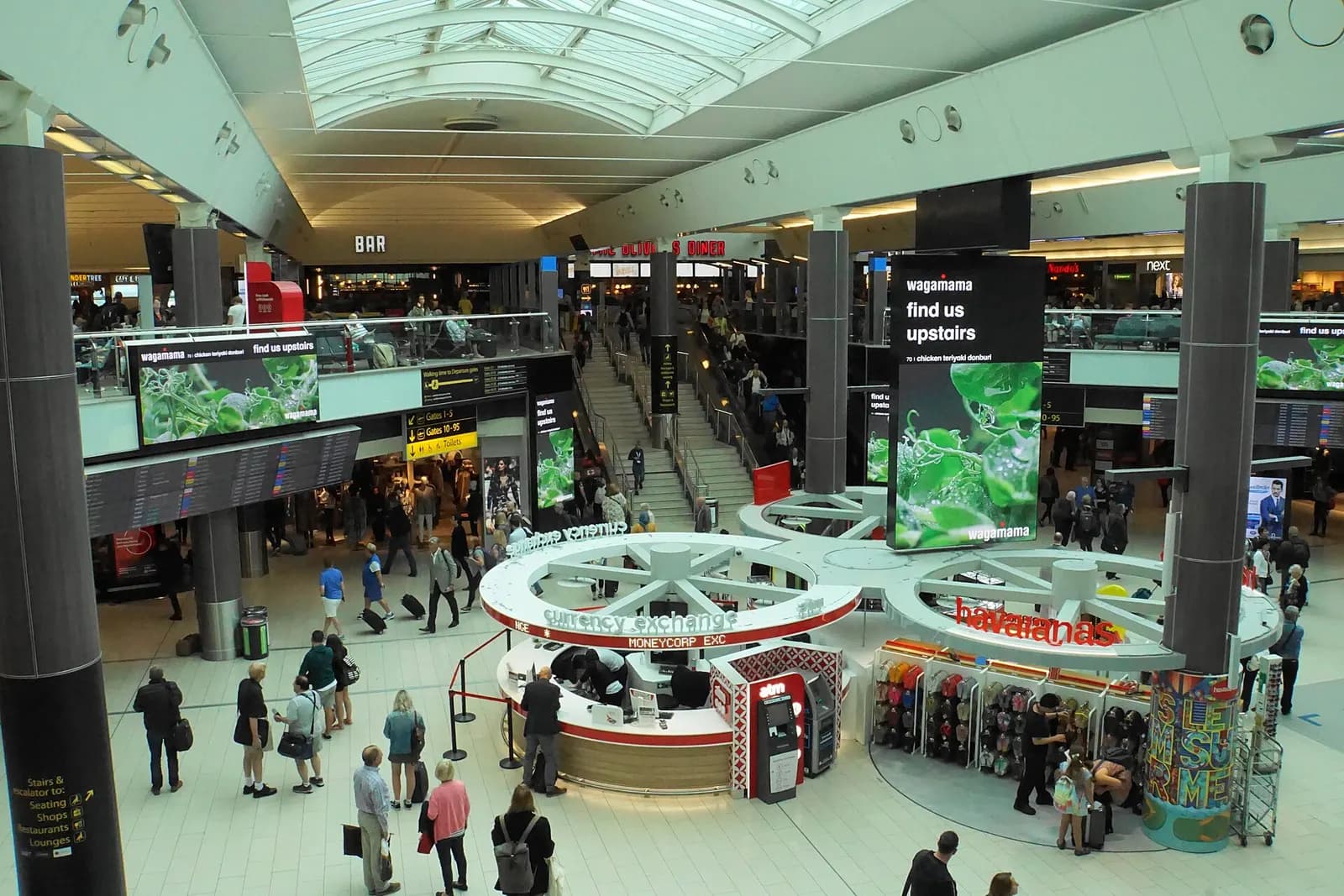 The glass-fronted South Terminal building at London Gatwick Airport seen from the forecourt.