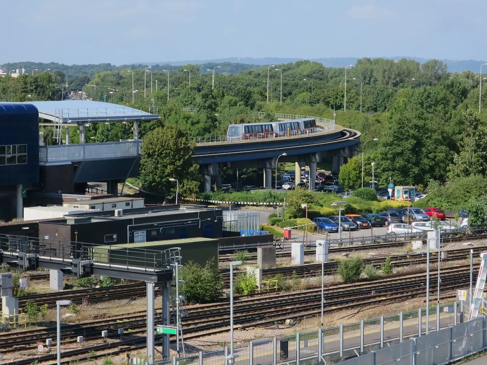 Railway tracks and the inter-terminal transit system at Gatwick Airport, with the South Terminal station visible at left.