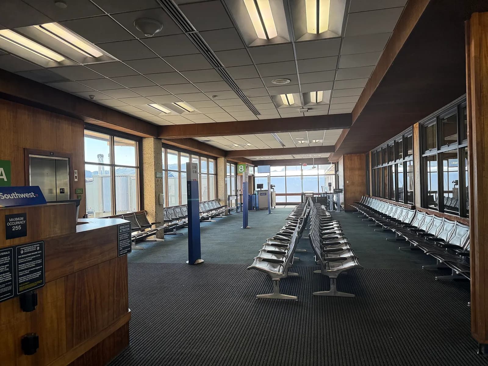 Air-conditioned Gate 8 holdroom with a Southwest podium at Lihue Airport