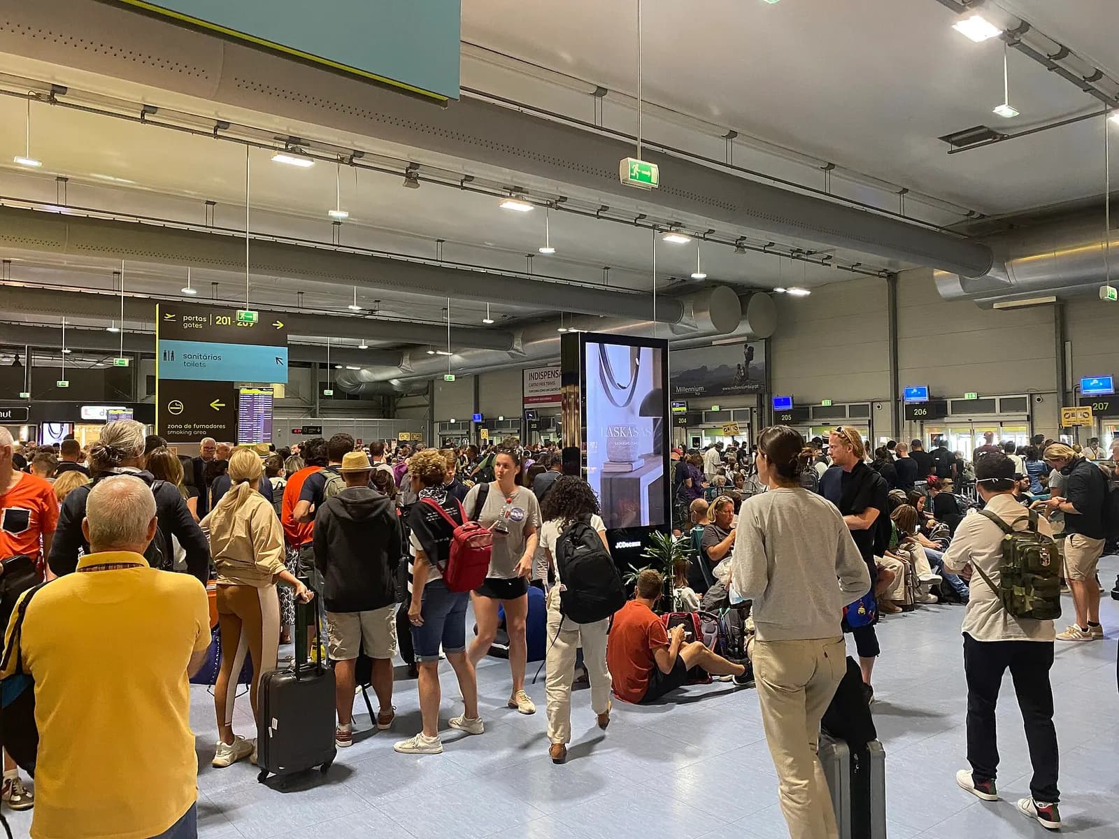 The spacious, modern interior of Terminal 2 with gates, seating, and signage for low-cost carriers.