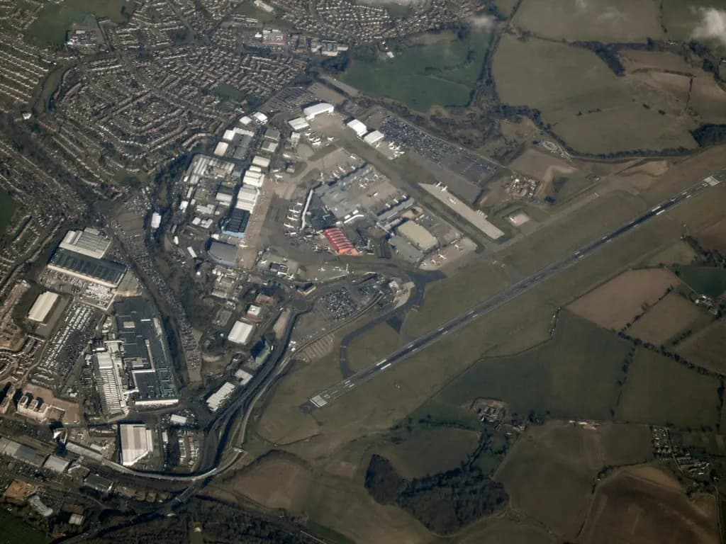 Aerial view of London Luton Airport runway, taxiways and terminal complex