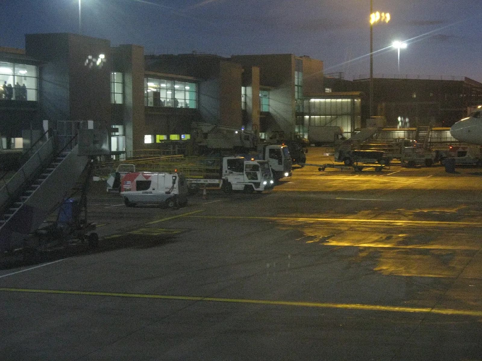 London Luton Airport buildings and apron lights in early evening