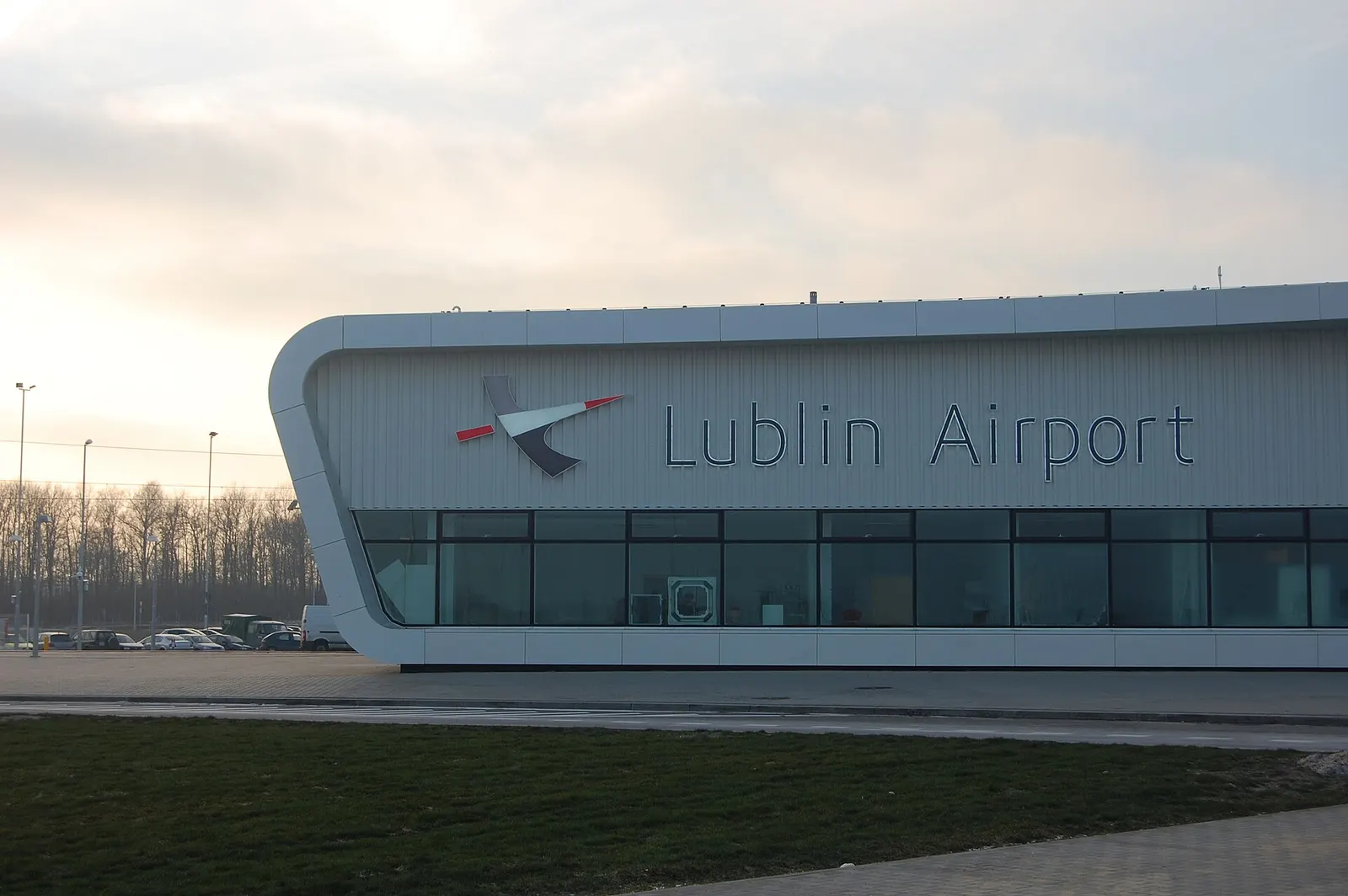 Close view of the Lublin Airport terminal facade and logo