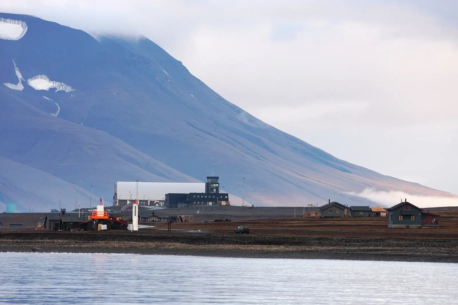 Vestpynten with Longyear Airport, Svalbard. With Vestpynten lighthouse from the 1930s.