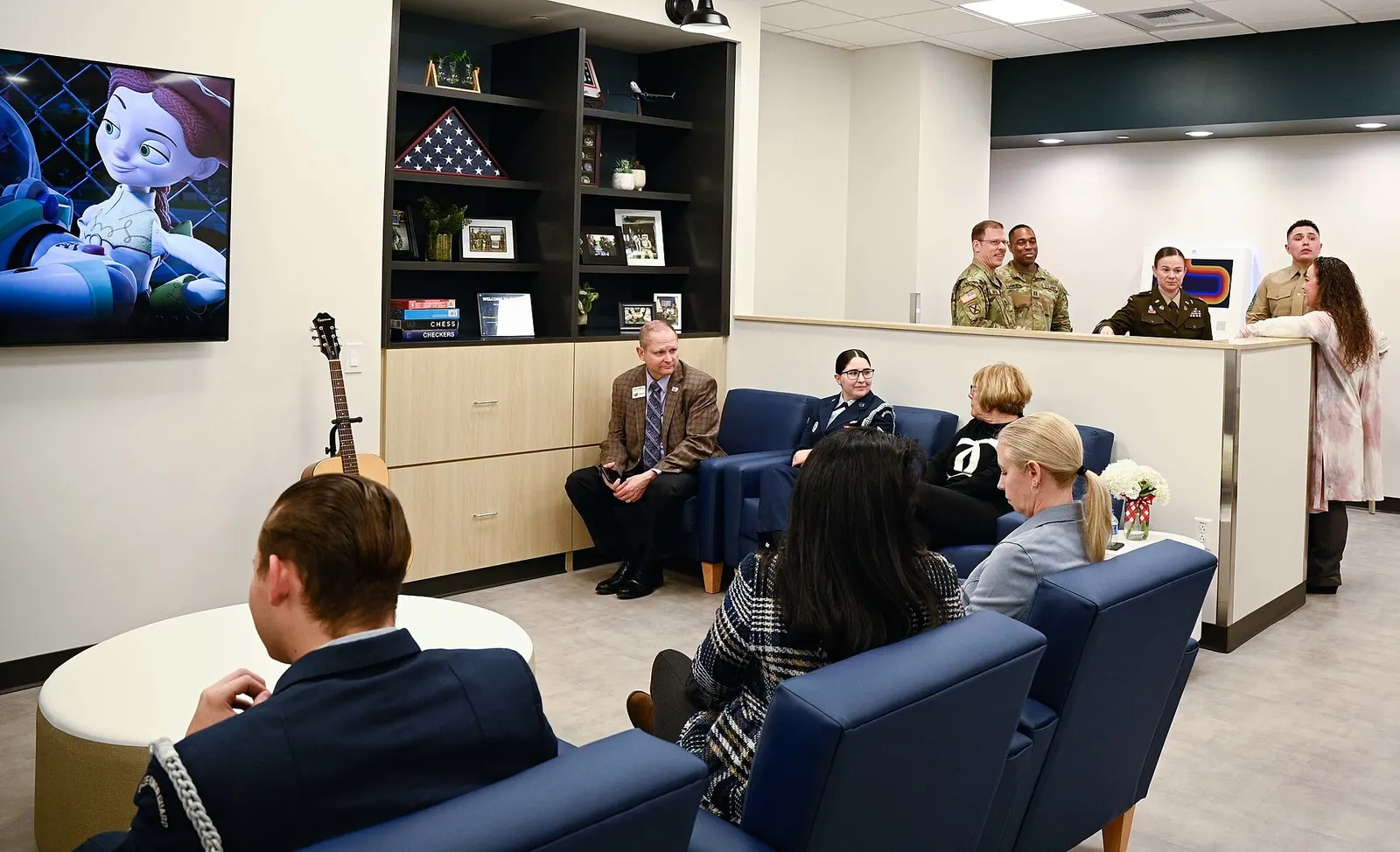 Attendees of the United Service Organizations Inc. ribbon-cutting ceremony explore the new airport center at the new terminal in the Kansas City International Airport in Kansas City, Missouri, Feb. 27, 2023. USO airport centers throughout the country offer around-the clock hospitality for traveling 