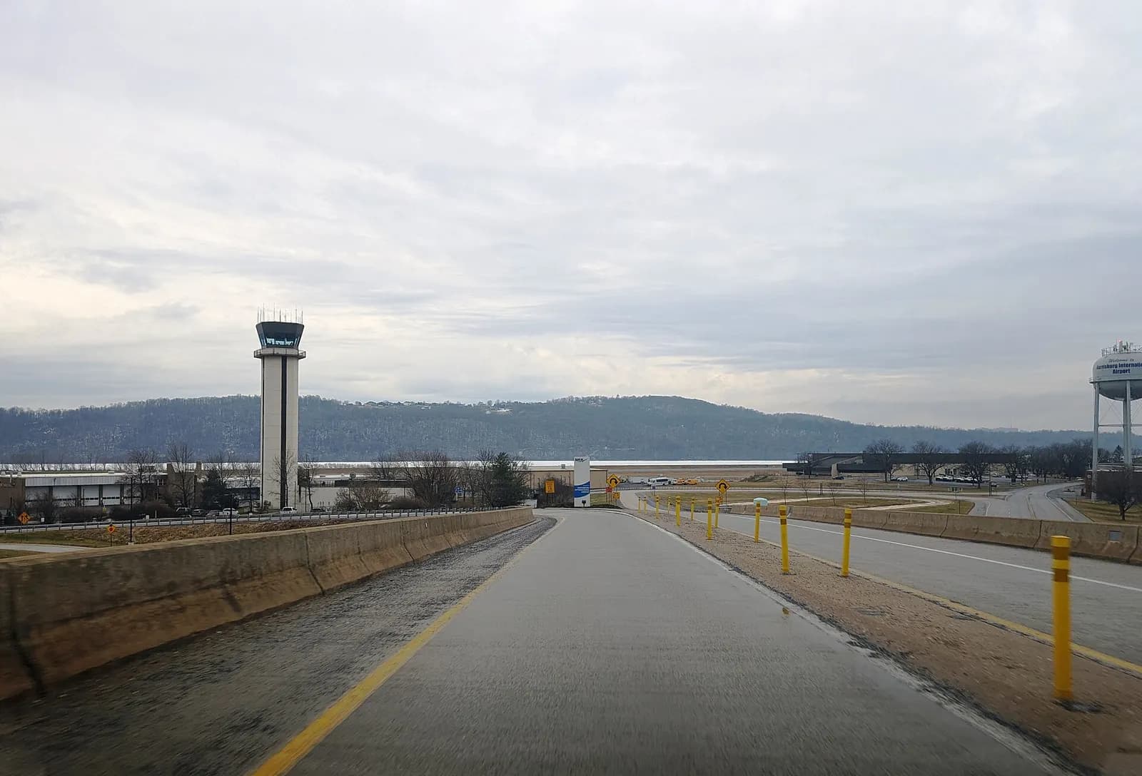 Harrisburg International Airport main roadway entrance, January 2025, with the control tower and Airport Connector over Airport Drive