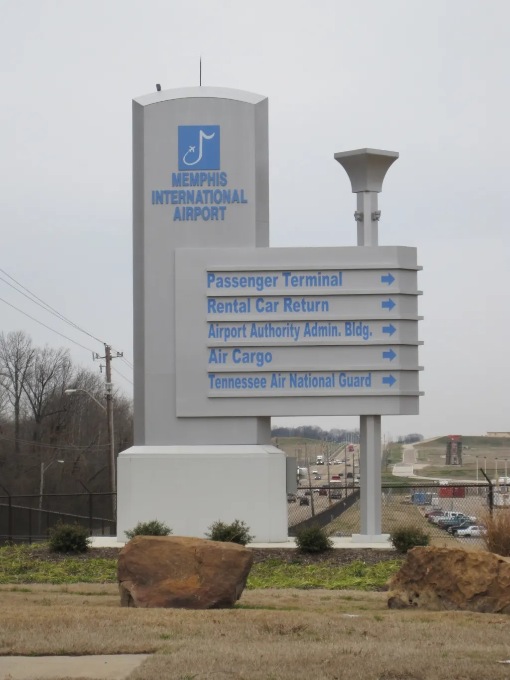 Roadside Memphis International Airport sign on the approach.