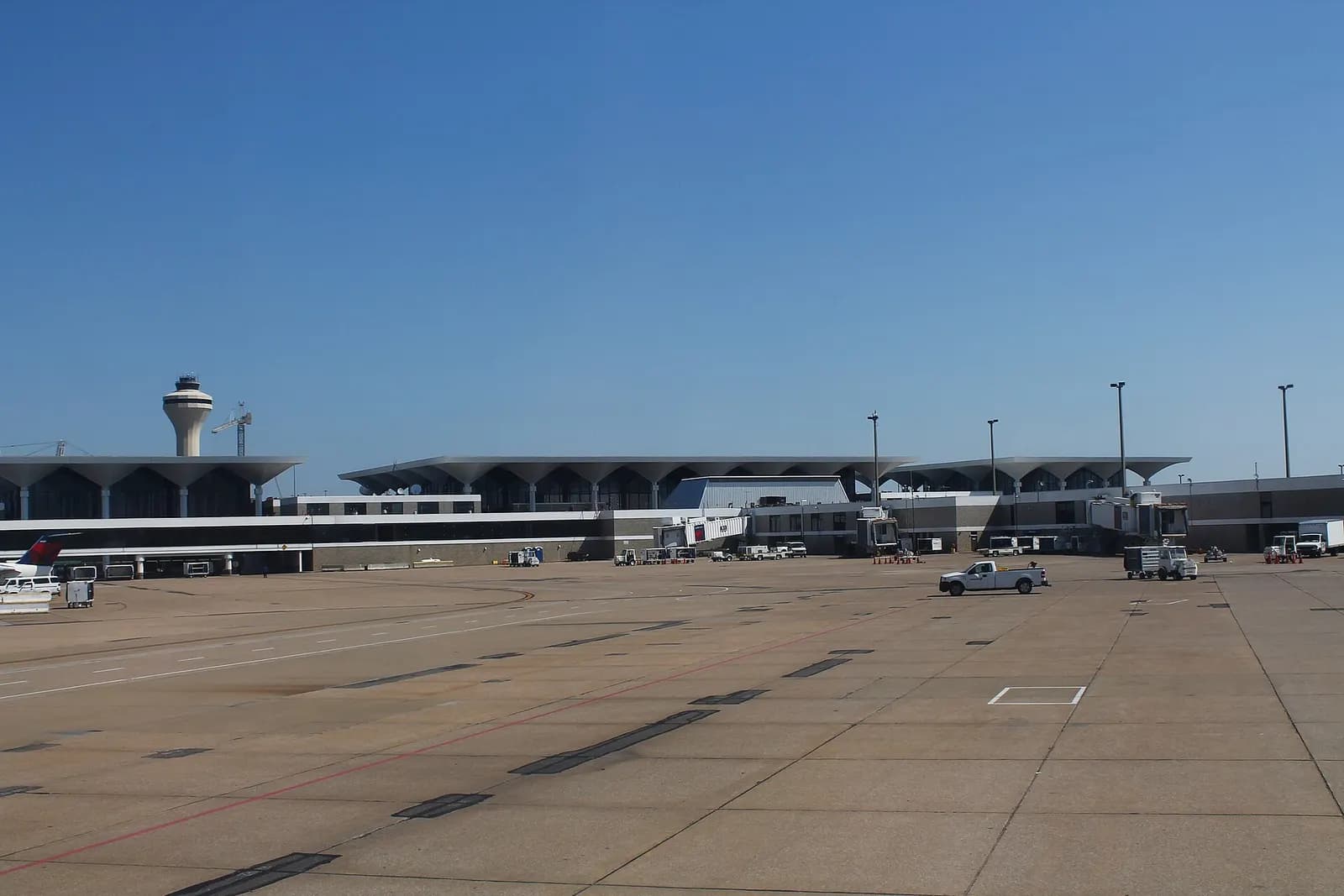 Airside view of the Memphis main terminal with martini-glass roof columns and the control tower.