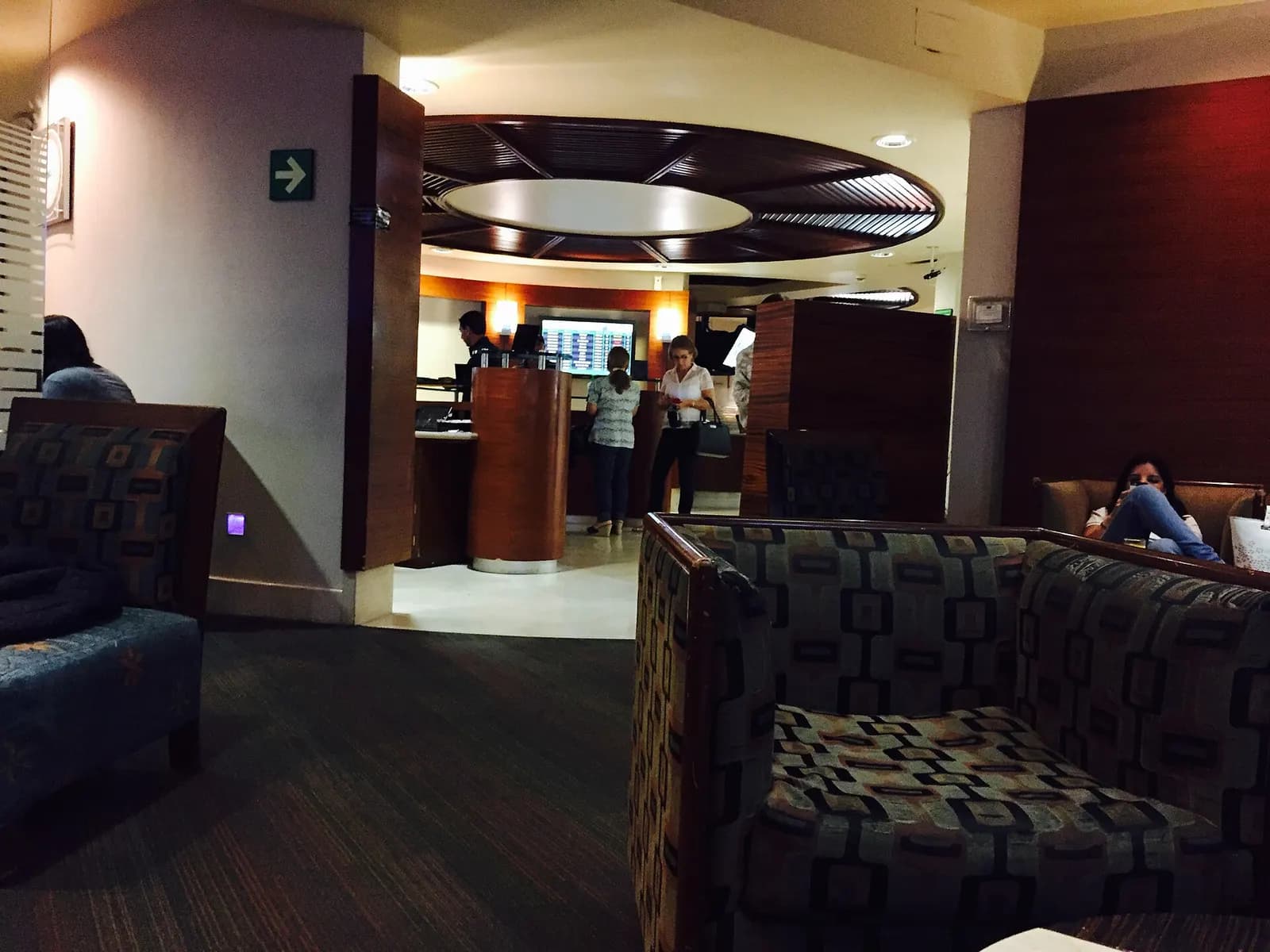 Beyond Lounge by Banamex in Terminal 2, with lounge seating, tables, and a bar area for waiting passengers.