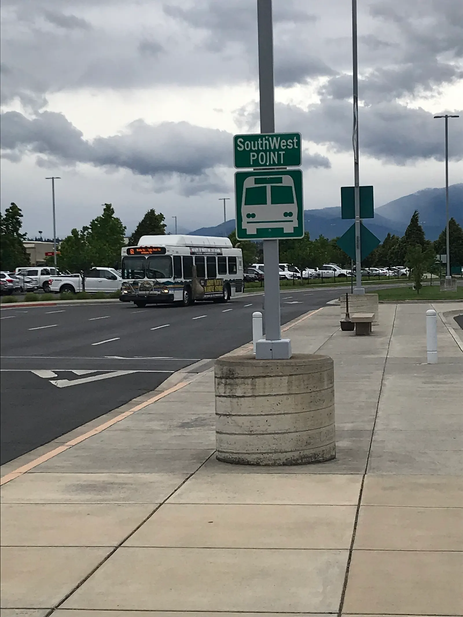 SouthWest POINT coach in front of the Medford Airport terminal building.