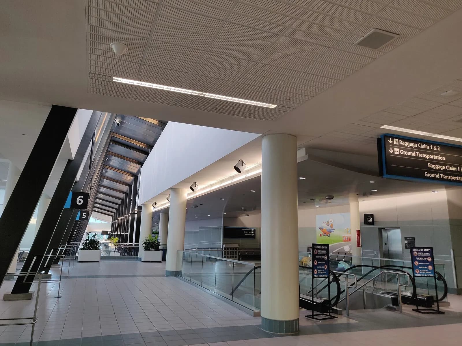 Escalators inside Manchester-Boston Regional Airport in July 2021
