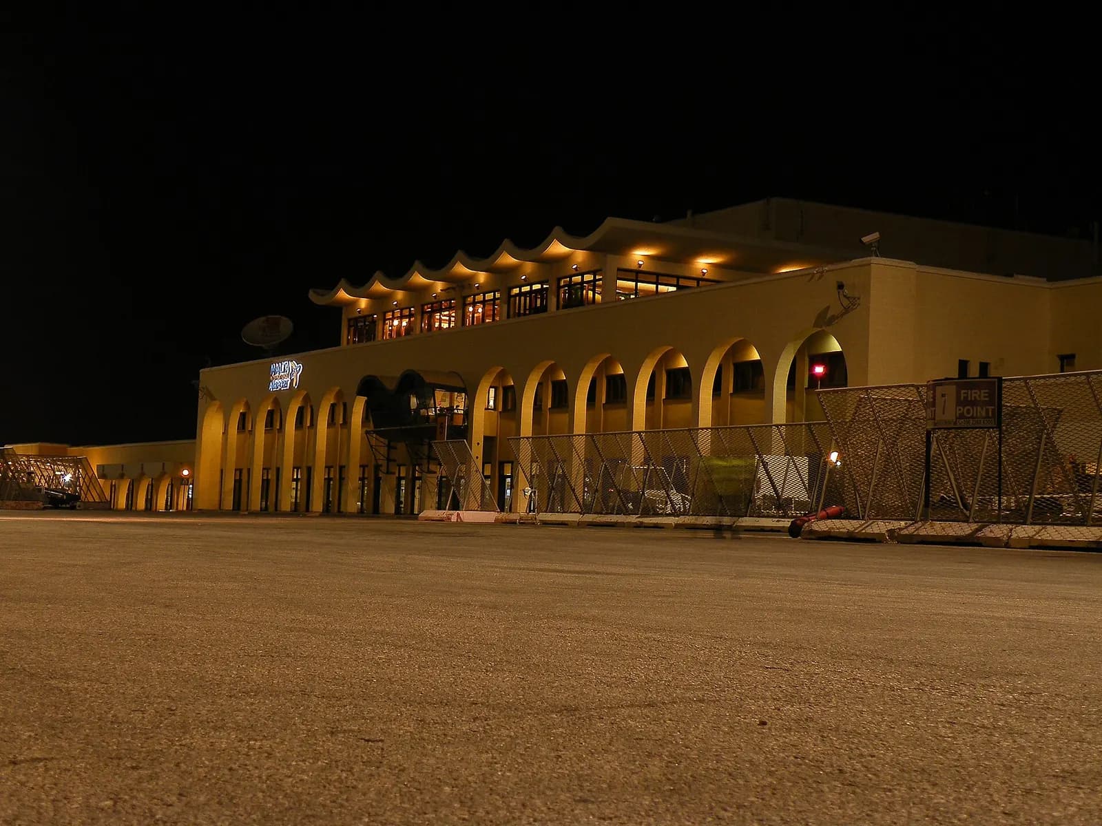 Terminal of the Malta Luqa International Airport, at night.