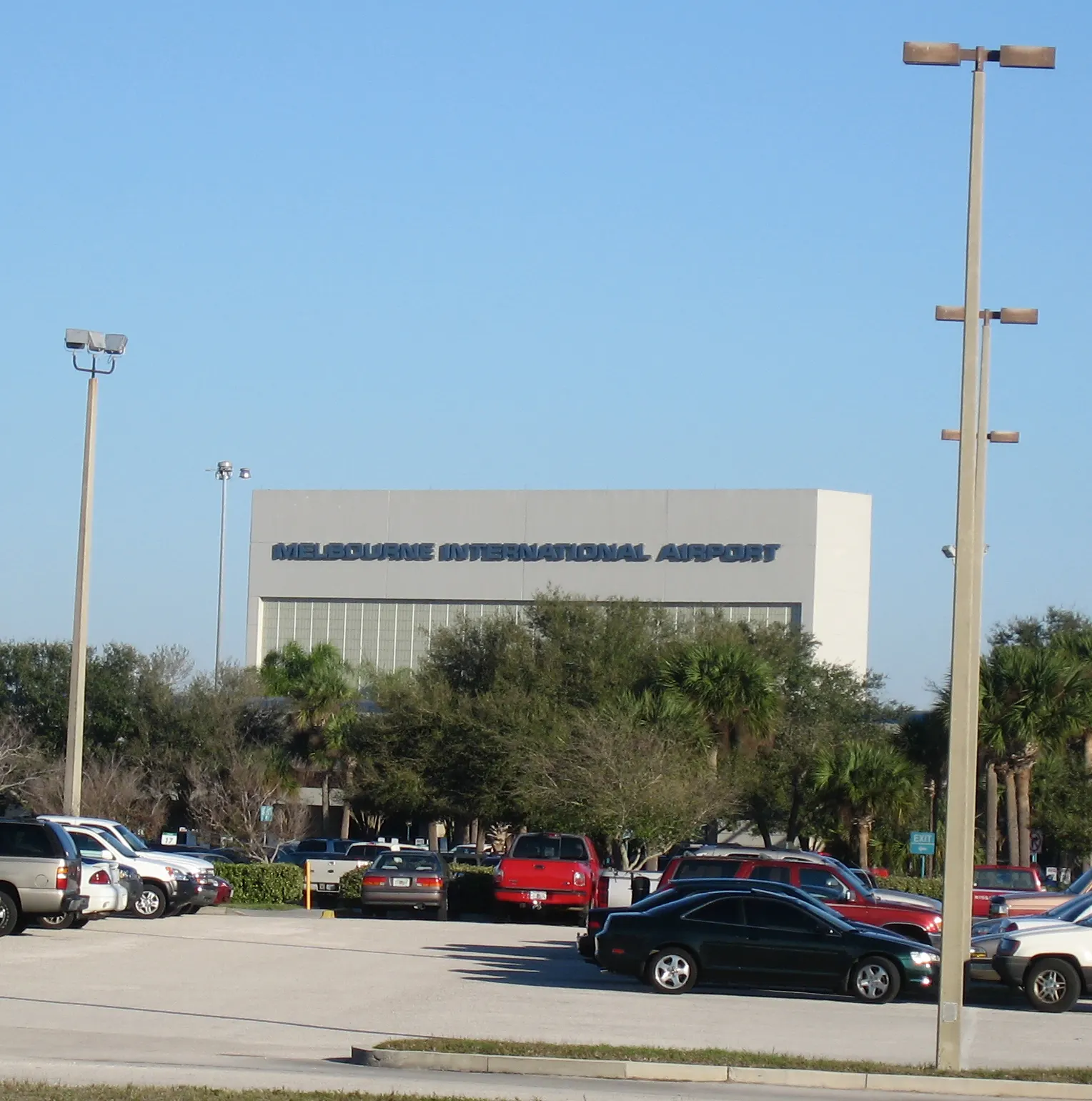 Main terminal building at Melbourne Orlando International Airport seen from the landside driveway.