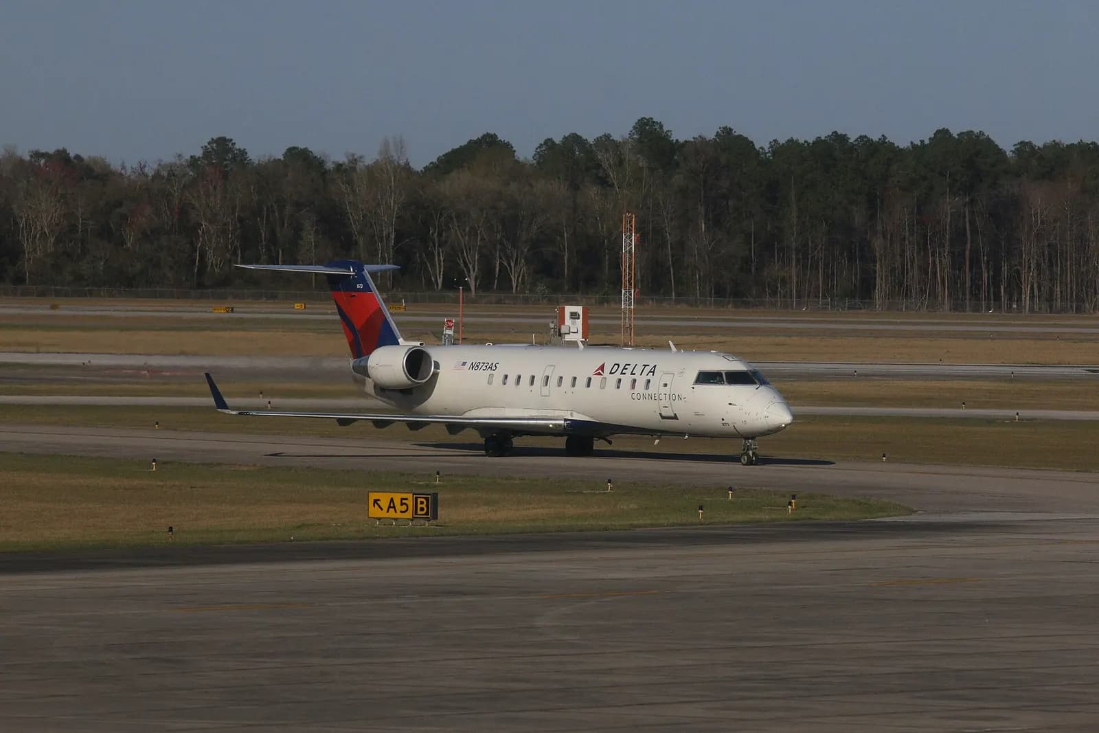 Delta Connection CRJ N873AS on the Mobile Regional Airport apron, photographed 14 March 2016.