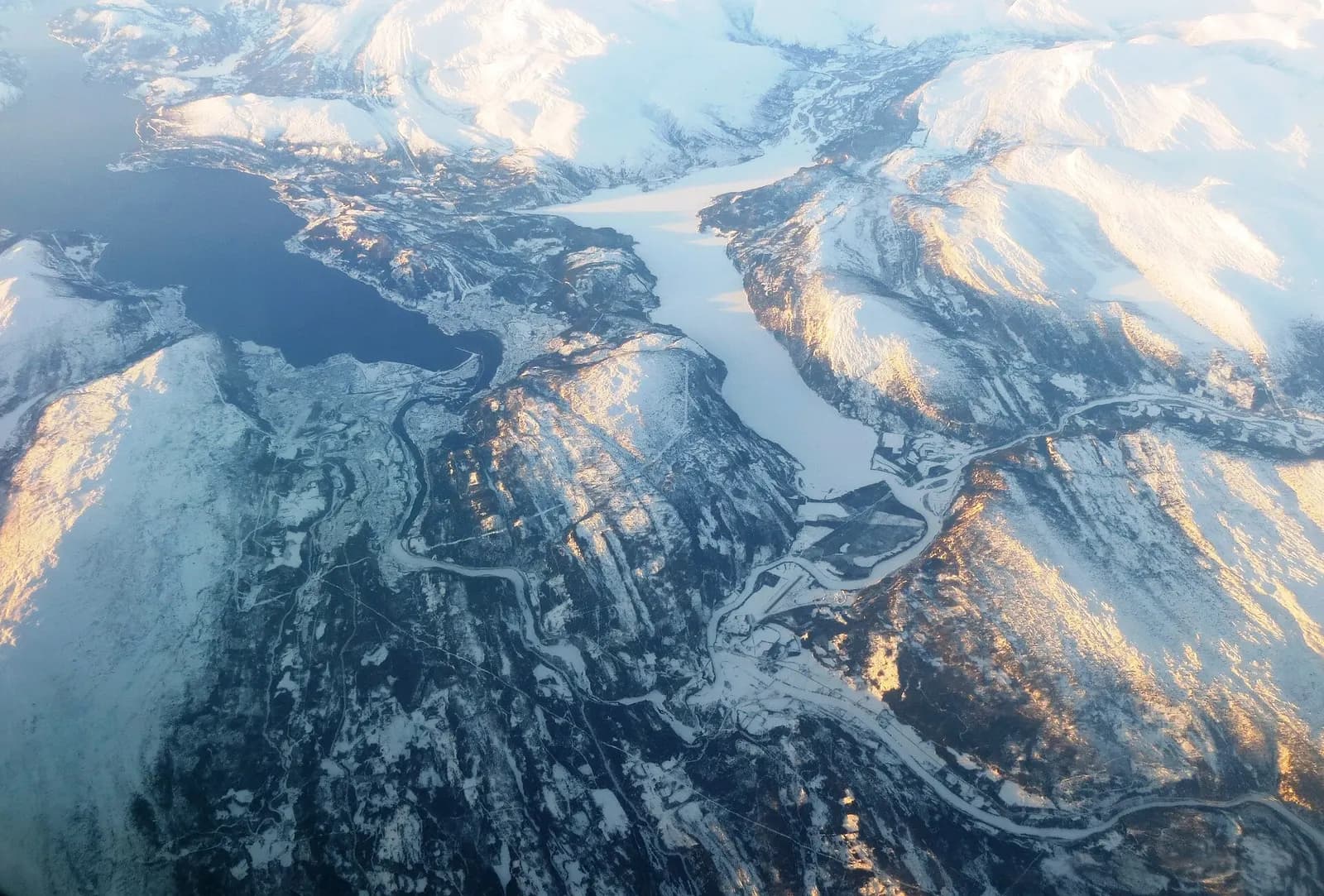 Aerial view from the (north)east towards the (south)west, over Rana municipality, with Mo I Rana city at the bottom of the Ranafjorden, Nordland County (Norway).