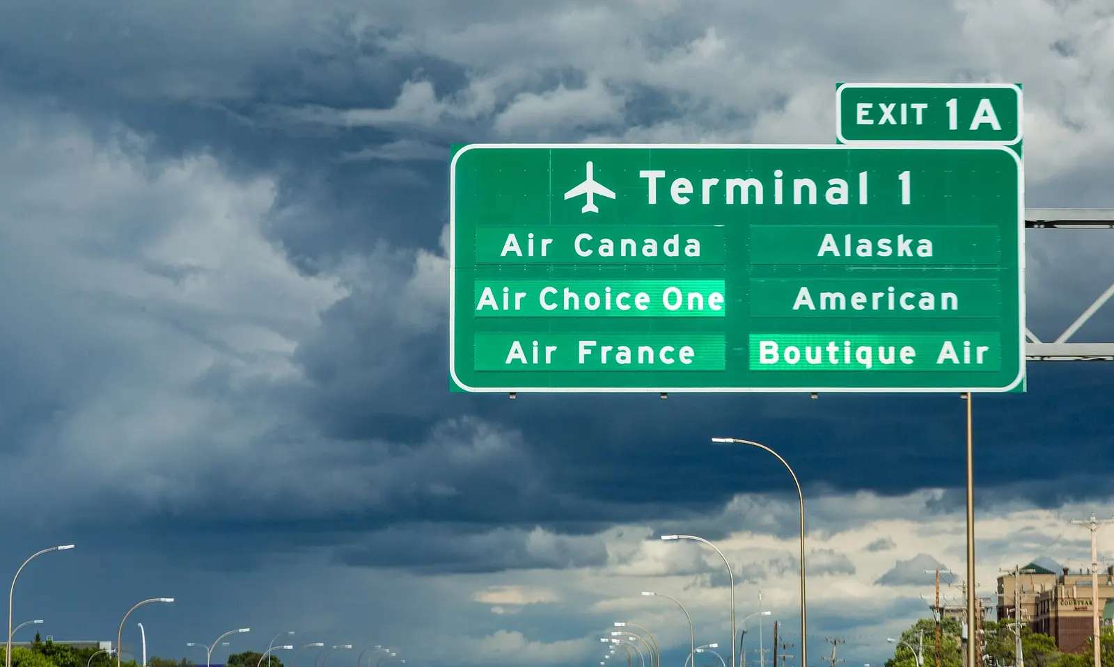 Sign for Minneapolis-St. Paul International Airport (MSP) along I-494 in Bloomington: Air Canada, Air Choice One, Air France, Alaska, America, Boutique Air