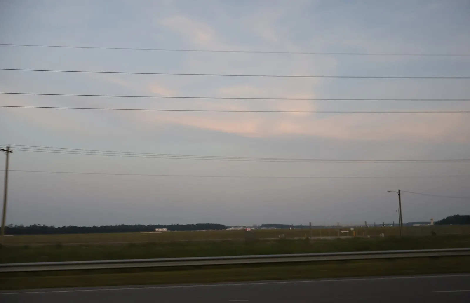 Myrtle Beach International Airport buildings and field from U.S. Route 17 on 10 June 2023.