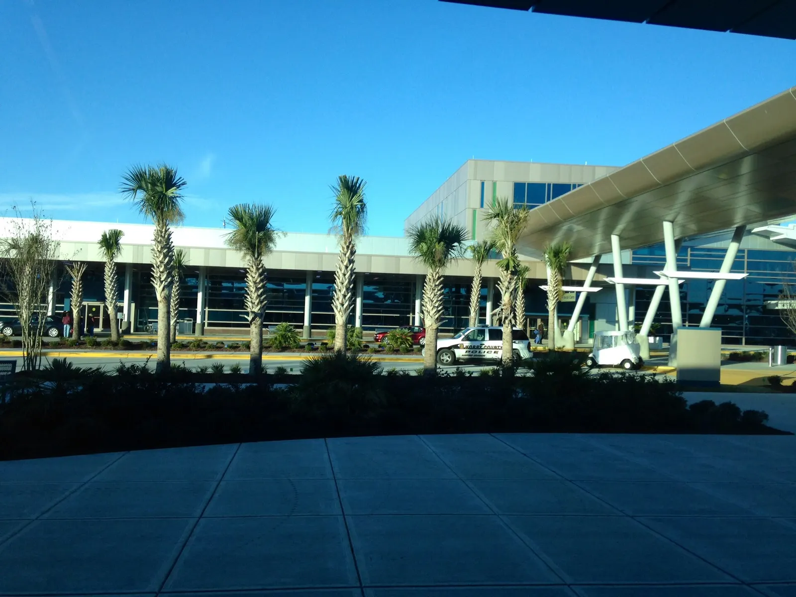 Daytime view of the Myrtle Beach International Airport terminal facade and curb from the parking side, photographed in January 2014.