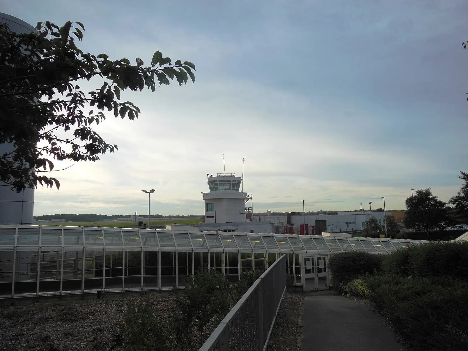 Walkway linking Newcastle Airport terminal to the Metro station with the old control tower beyond