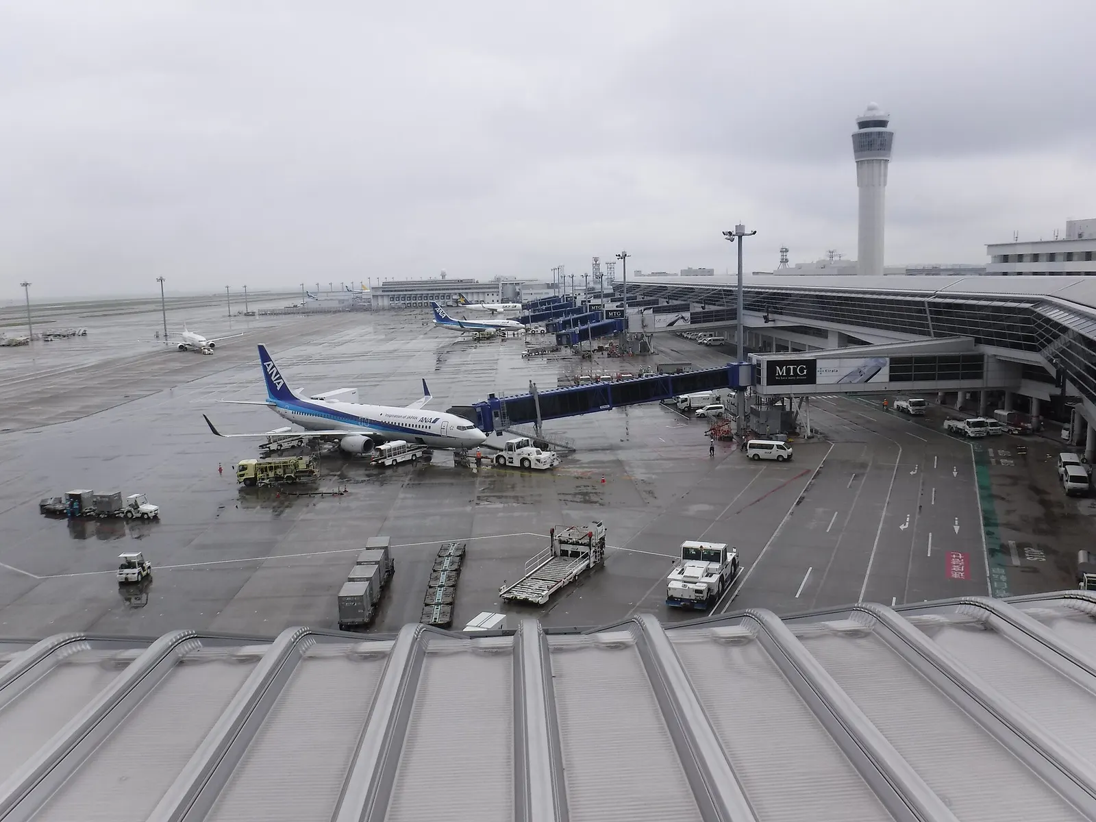 A view of the Chubu Centrair International Airport plane area and control tower.