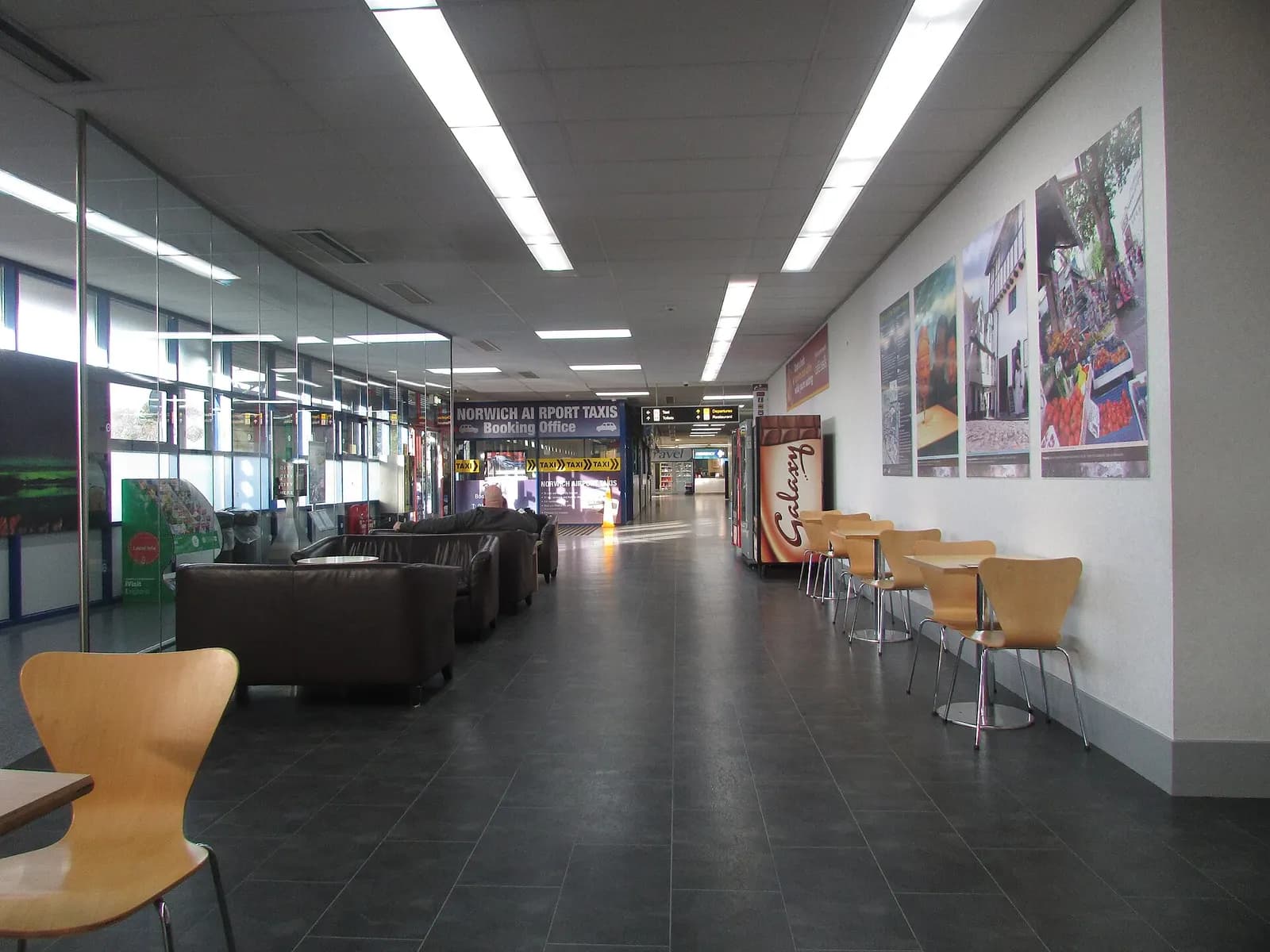 A waiting area and Taxi office inside the public area of Norwich Airport which is located north of the city of Norwich , Norfolk, England.