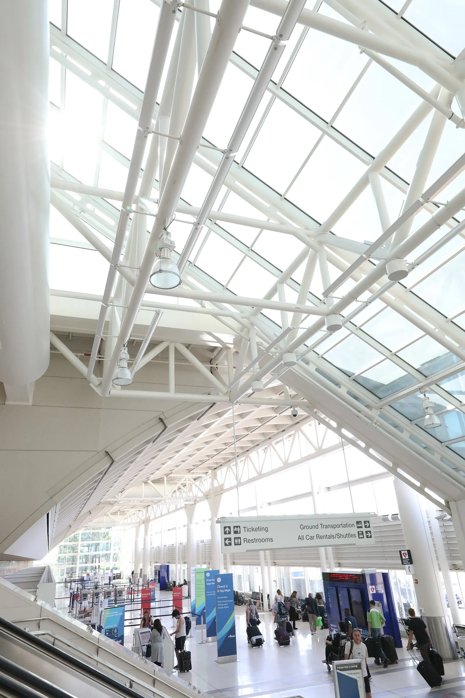 Ontario Terminal 2 ticketing lobby with check-in islands under the high white ceiling.