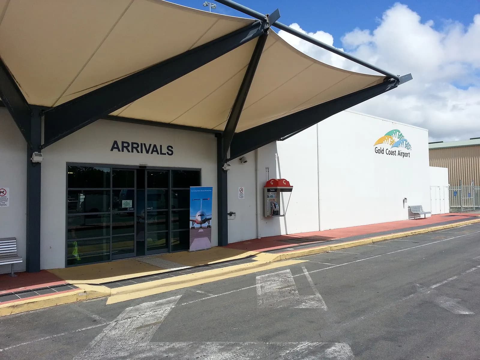 Gold Coast Airport arrivals entrance with tensile canopy and airport branding