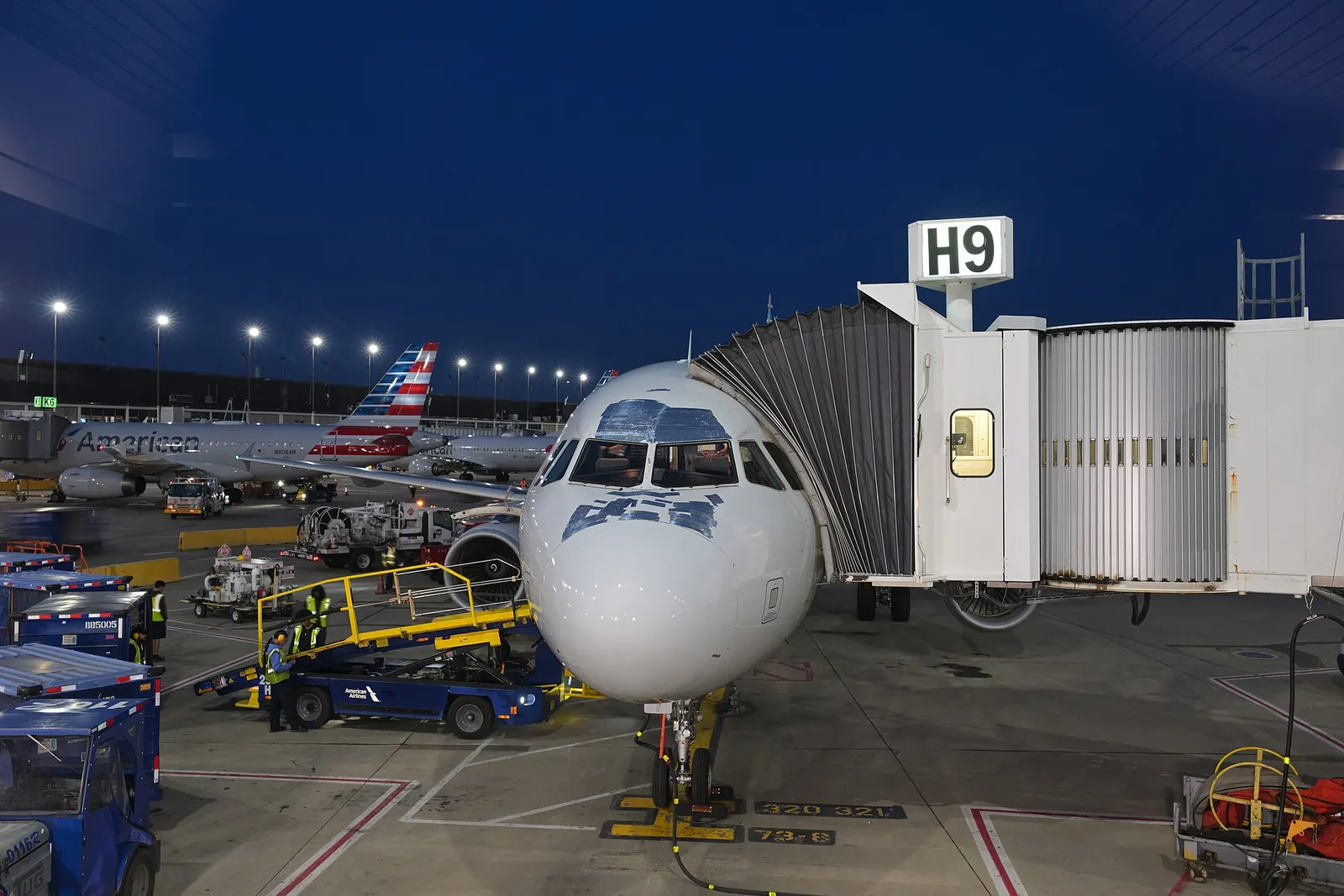 American Airlines Airbus A321 N156UW at gate H9 at Chicago O'Hare International Airport, after having flown flight #1717 from Vancouver. Note the extensive amount of speed tape on the nose.